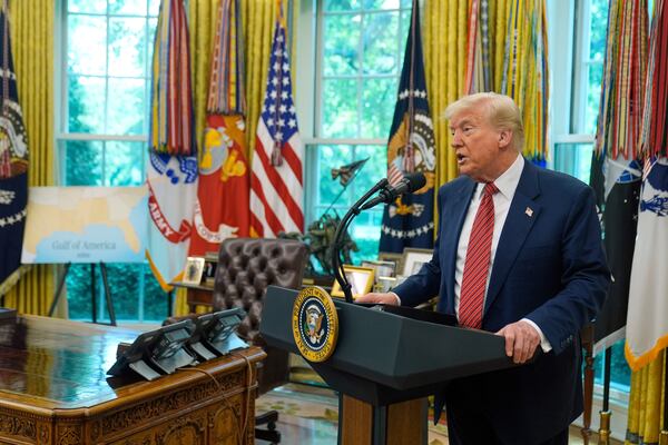 President Donald Trump speaks to reporters after David Perdue was sworn in as U.S. Ambassador to China during a ceremony in the Oval Office of the White House, Wednesday, May 7, 2025, in Washington. (AP Photo/Mark Schiefelbein)