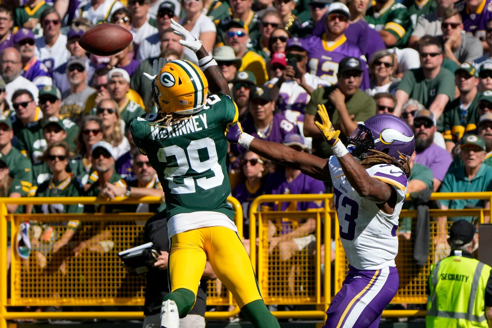 Green Bay Packers safety Xavier McKinney (29) intercepts a pass intended for Minnesota Vikings running back Aaron Jones, right, during the second half of an NFL football game Sunday, Sept. 29, 2024, in Green Bay, Wis. (AP Photo/Morry Gash)