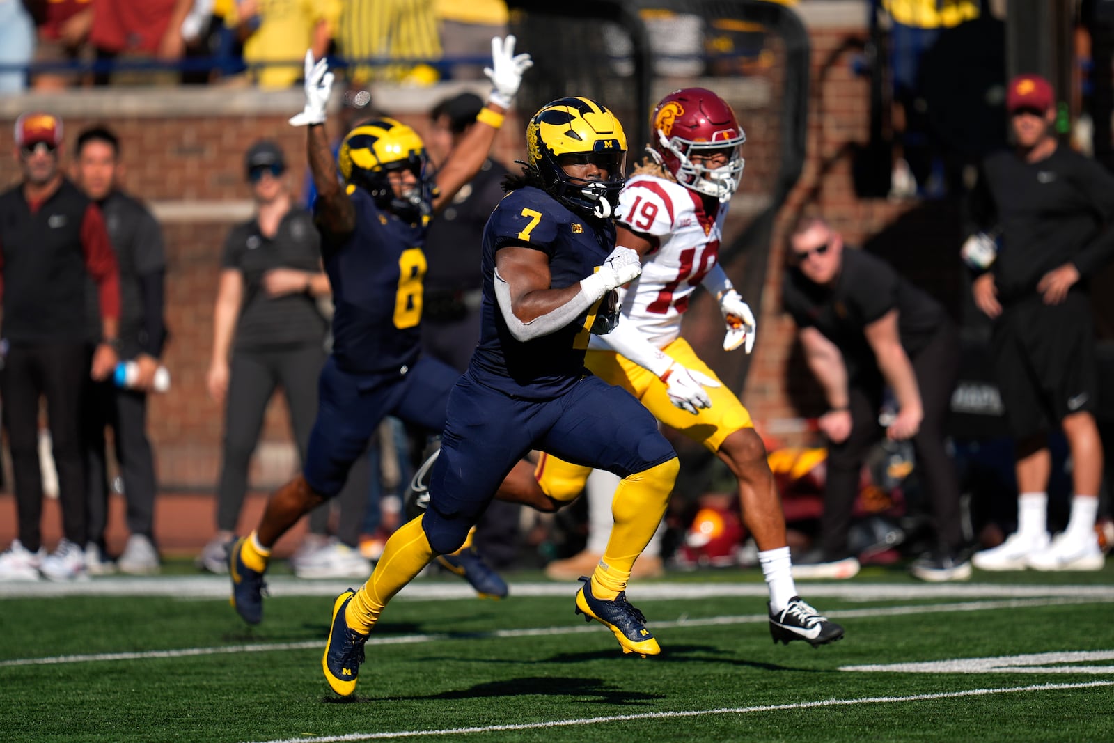 Michigan running back Donovan Edwards (7) runs for a 41-yard touchdown as Southern California cornerback John Humphrey (19) defends in the first half of an NCAA college football game in Ann Arbor, Mich., Saturday, Sept. 21, 2024. (AP Photo/Paul Sancya)