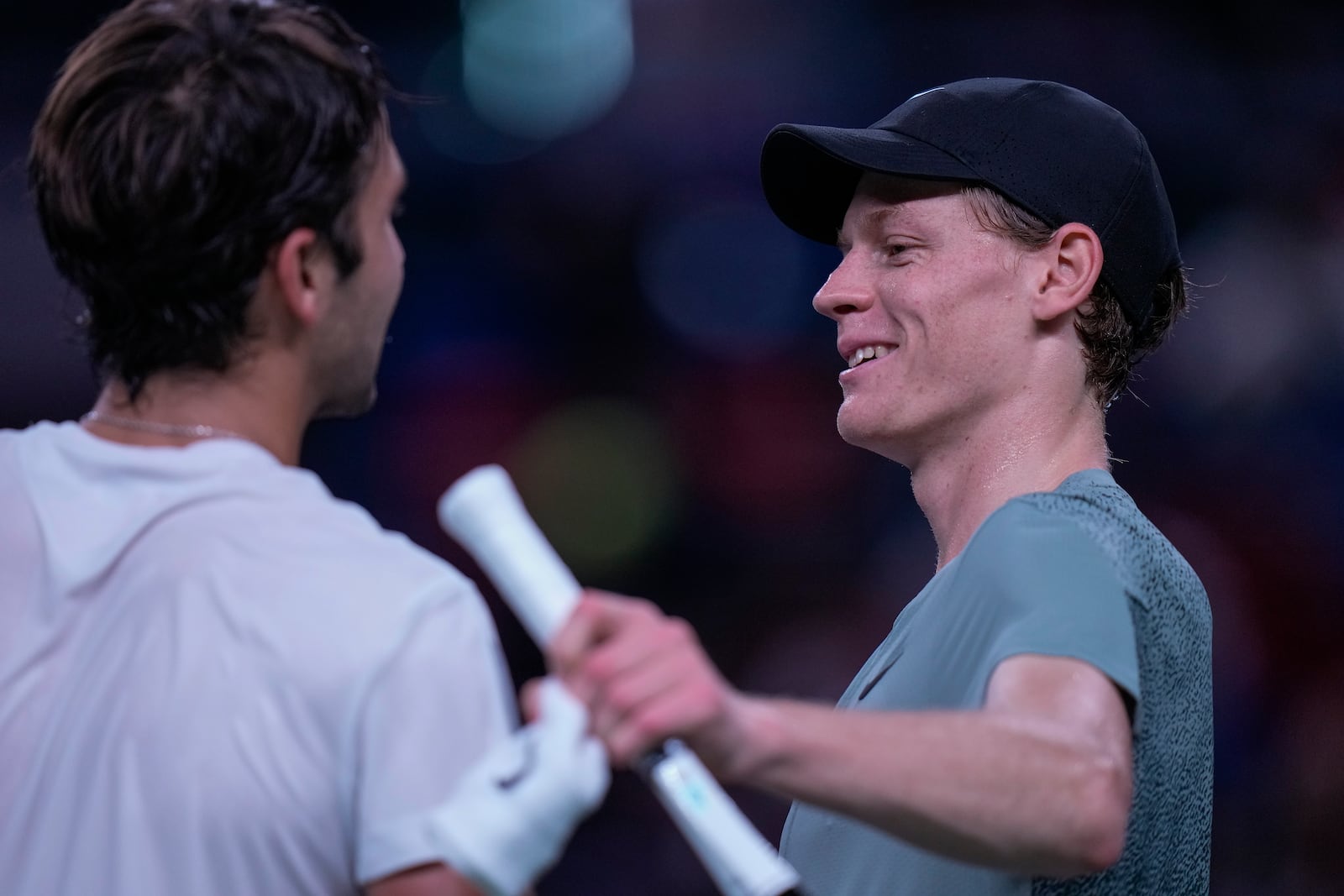 Jannik Sinner of Italy, right, is congratulated by Tomas Martin Etcheverry of Argentina after winning in the men's singles third round match in the Shanghai Masters tennis tournament at Qizhong Forest Sports City Tennis Center in Shanghai, China, Sunday, Oct. 6, 2024. (AP Photo/Andy Wong)