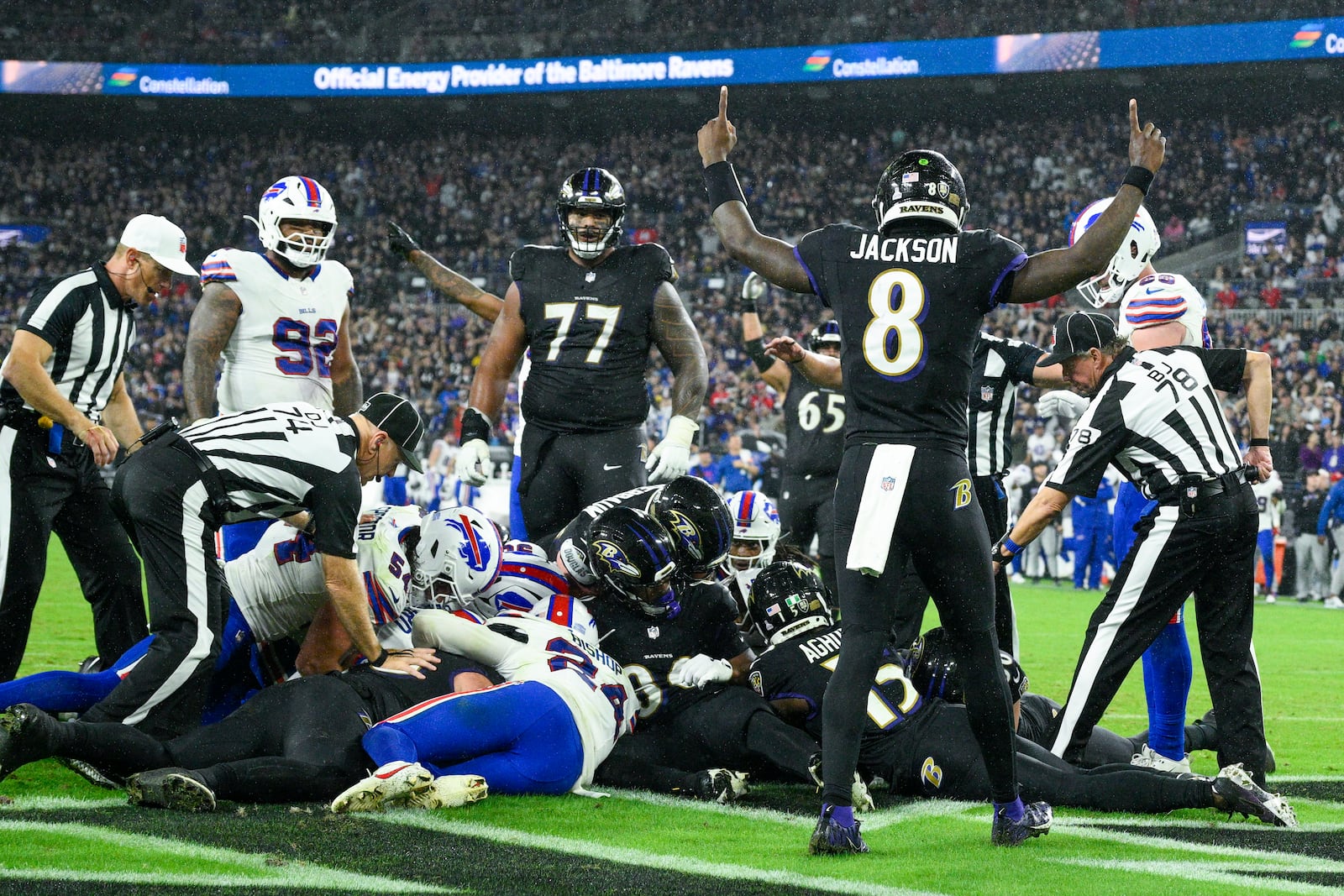 Baltimore Ravens quarterback Lamar Jackson (8) reacts as officials look through a pile of players to make a decision on a touchdown fumble recovery by Ravens' Patrick Ricard during the second half of an NFL football game against the Buffalo Bills, Sunday, Sept. 29, 2024, in Baltimore. (AP Photo/Nick Wass)