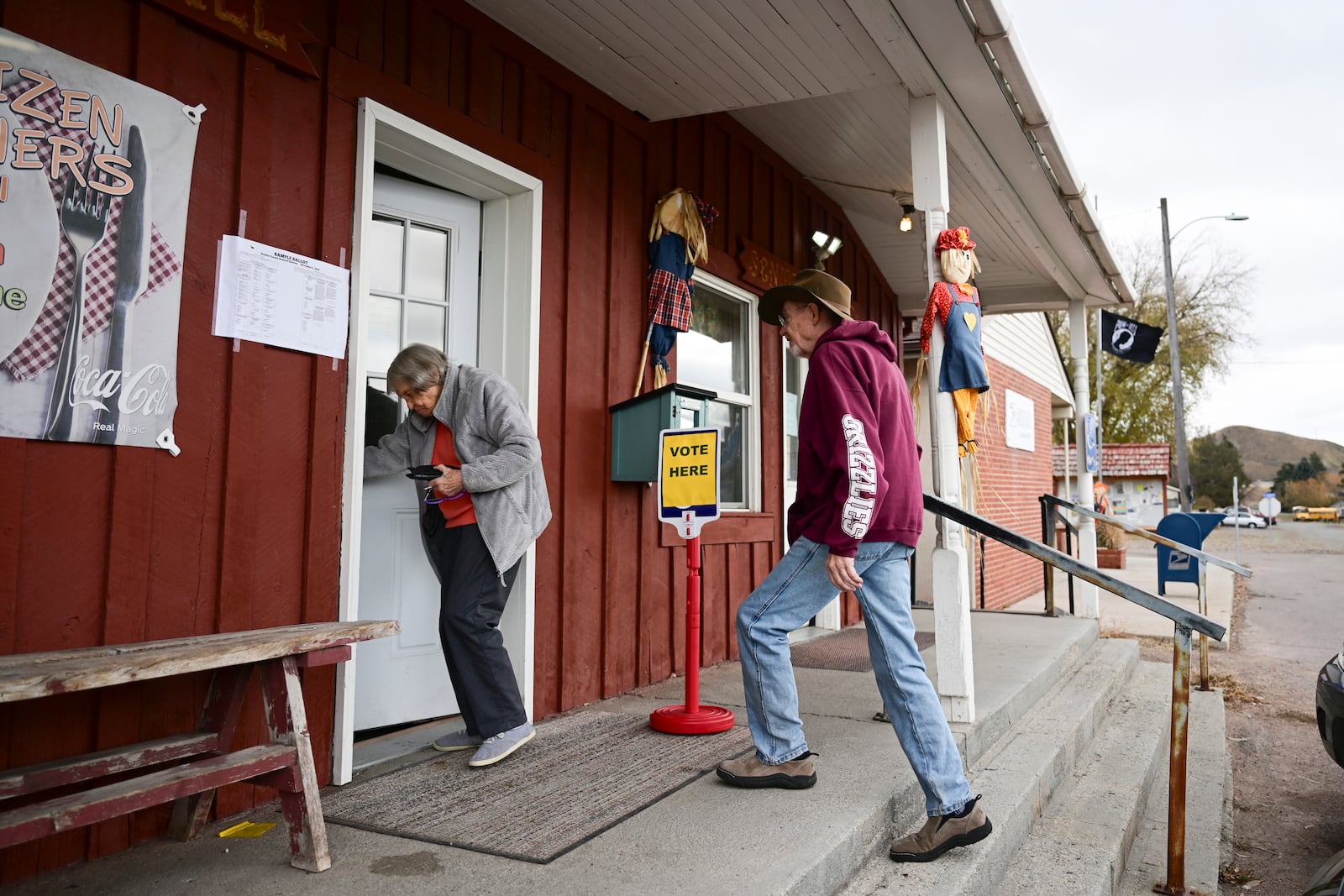 Charles and Pearl Cunningham walk into Drummond Community Hall to vote in Drummond, Mont., on Election Day, Tuesday, Nov. 5, 2024. (AP Photo/Tommy Martino)