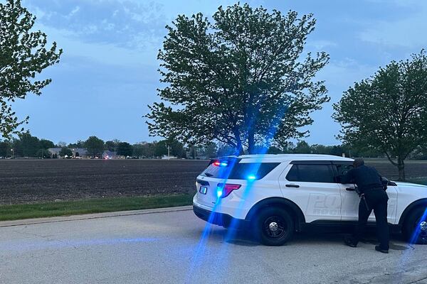Police block a road leading to a building where a car smashed through during an after-school program, killing several people and injuring others, Monday, April 28, 2025, in Chatham, Ill. (AP Photo/John O'Connor)