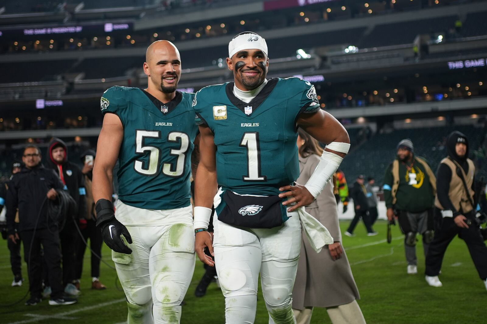 Philadelphia Eagles quarterback Jalen Hurts (1) and linebacker Zack Baun (53) head off the field following an NFL football game against the Washington Commanders Thursday, Nov. 14, 2024, in Philadelphia. The Eagles won 26-18. (AP Photo/Matt Slocum)