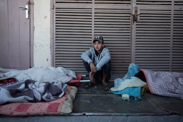 A Palestinian youth mourns nine people killed in an Israeli strike in Bureij refugee camp, Gaza Strip, Friday, Nov. 15, 2024. (AP Photo/Abdel Kareem Hana)