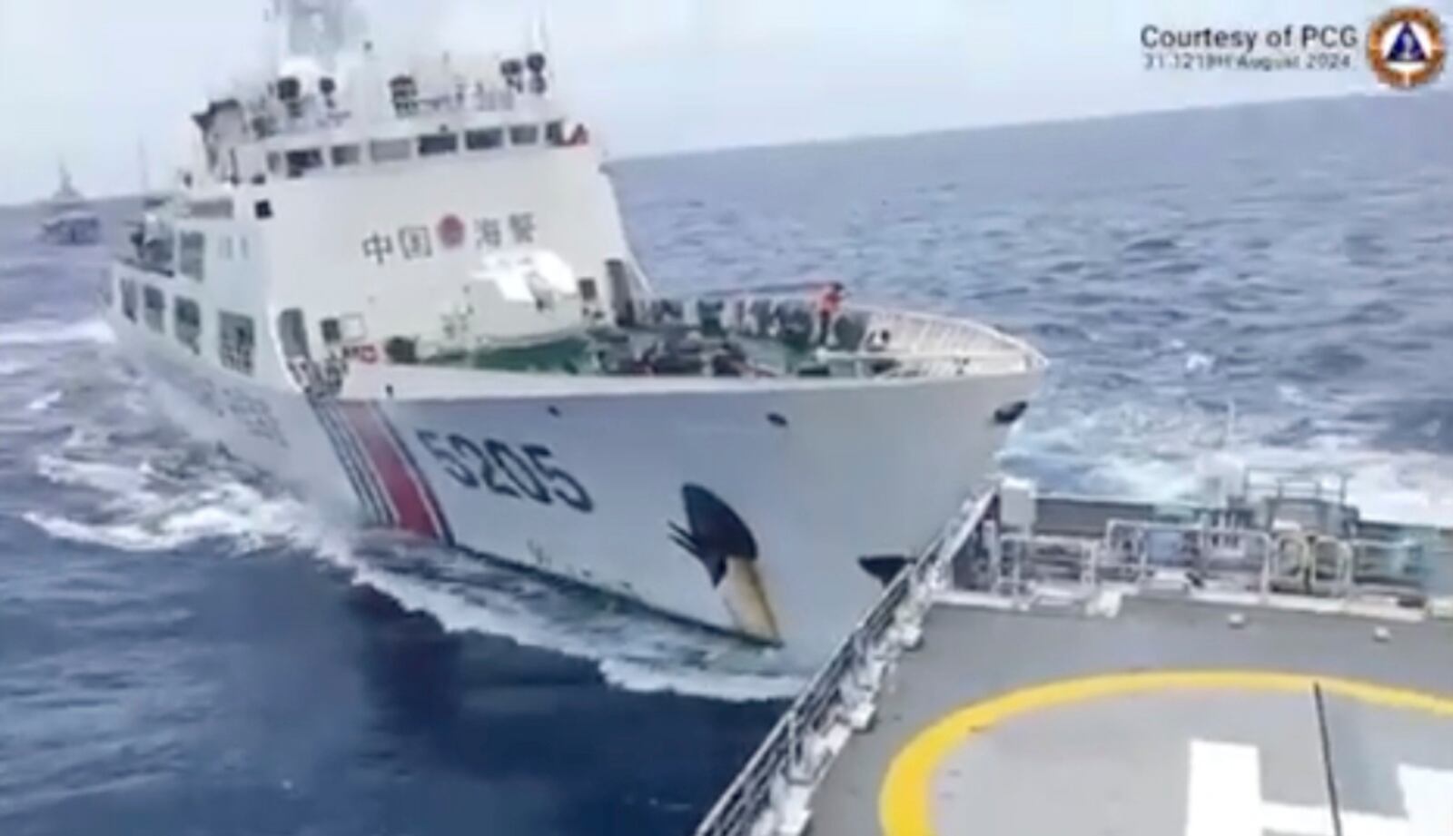 FILE - In this image taken from handout video provided by the Philippine Coast Guard, a Chinese Coast Guard ship with bow number 5205, right, collides with Philippine Coast Guard vessel BRP Teresa Magbanua near the Sabina Shoal at the disputed South China Sea, Saturday Aug. 31, 2024. (Philippine Coast Guard via AP, File)