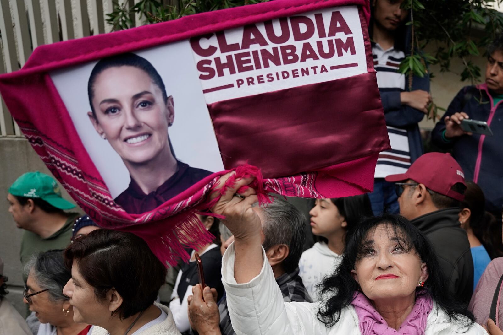 Supporters gather outside the house of Claudia Sheinbaum on her inauguration day as president in Mexico City, Tuesday, Oct. 1, 2024. (AP Photo/Aurea Del Rosario)