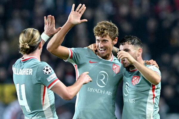 Atletico's scorer Marcos Llorente, center, celebrates with teammates their side's second goal during the UEFA Champions League opening phase soccer match between Sparta Prague and Athletico Madrid in Prague, Czech Republic, Tuesday, Nov. 26, 2024. (Michaela Rihova/CTK via AP)