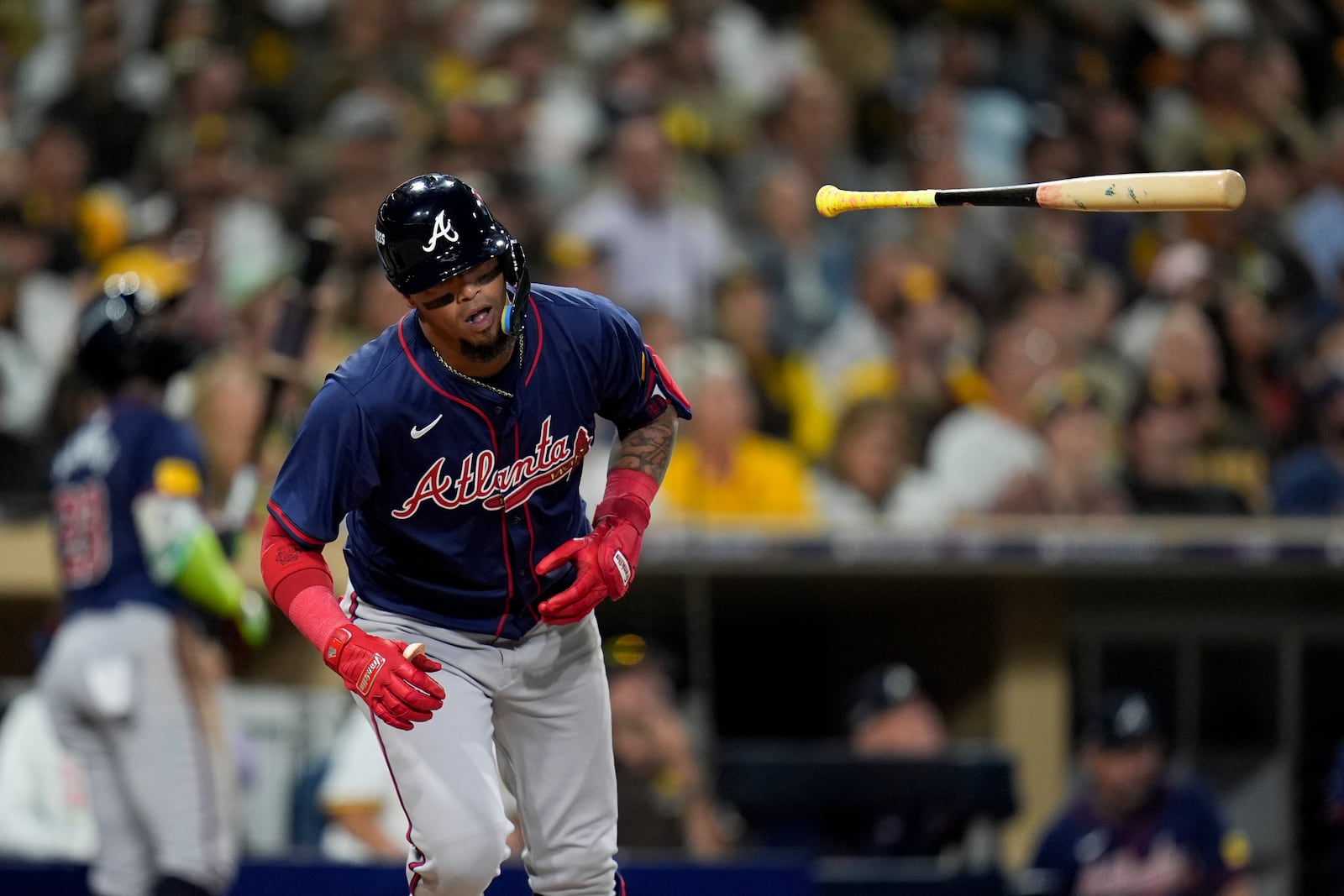 Atlanta Braves' Orlando Arcia tosses his bat as he flies out during the fifth inning in Game 1 of an NL Wild Card Series baseball game against the San Diego Padres,Tuesday, Oct. 1, 2024, in San Diego. (AP Photo/Gregory Bull)