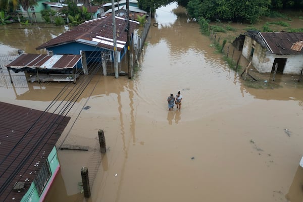 A general view of the Suyapa neighborhood, partially flooded by the Ulúa River's overflow after Tropical Storm Sara, in Potrerillos, Honduras, Sunday, Nov. 17, 2024. (AP Photo/Moises Castillo)