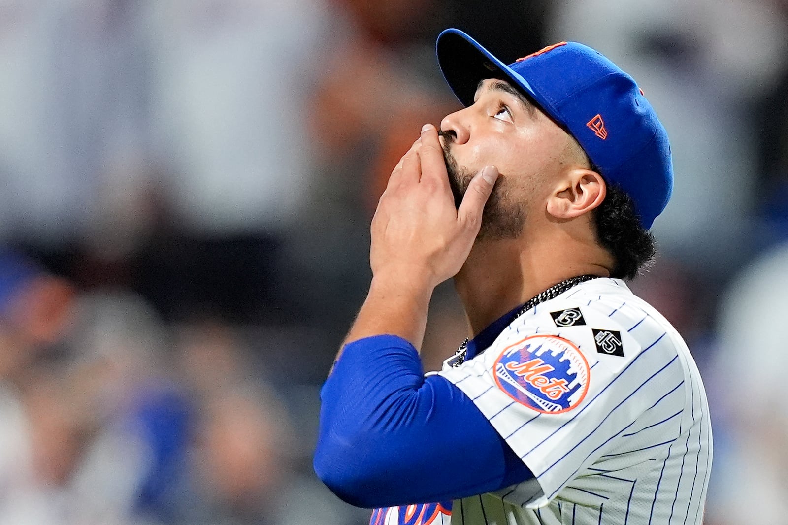 New York Mets pitcher Sean Manaea (59) reacts as he walks off the field at the end of the top of the seventh inning of Game 3 of the National League baseball playoff series against the Philadelphia Phillies, Tuesday, Oct. 8, 2024, in New York. (AP Photo/Frank Franklin II)