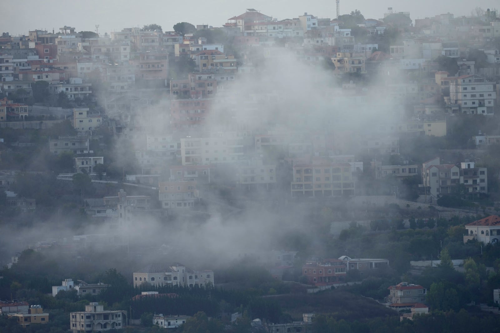 Smoke rises from an Israeli airstrike on Khiam village, as seen from Marjayoun town, south Lebanon, Monday, Sept. 23, 2024. (AP Photo/Hussein Malla)