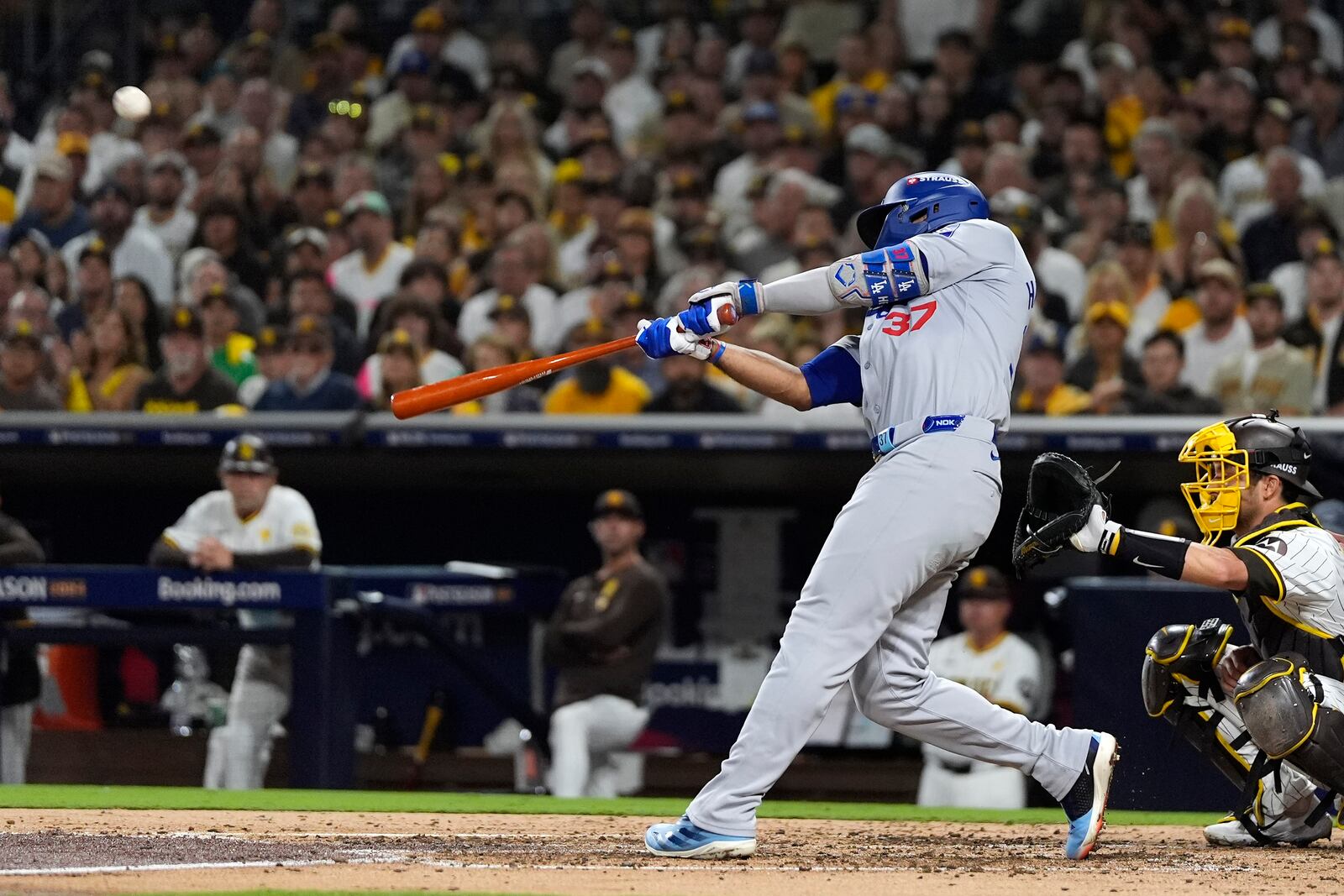 Los Angeles Dodgers' Teoscar Hernández connects for a grand slam during the third inning in Game 3 of a baseball NL Division Series against the San Diego Padres, Tuesday, Oct. 8, 2024, in San Diego. (AP Photo/Gregory Bull)