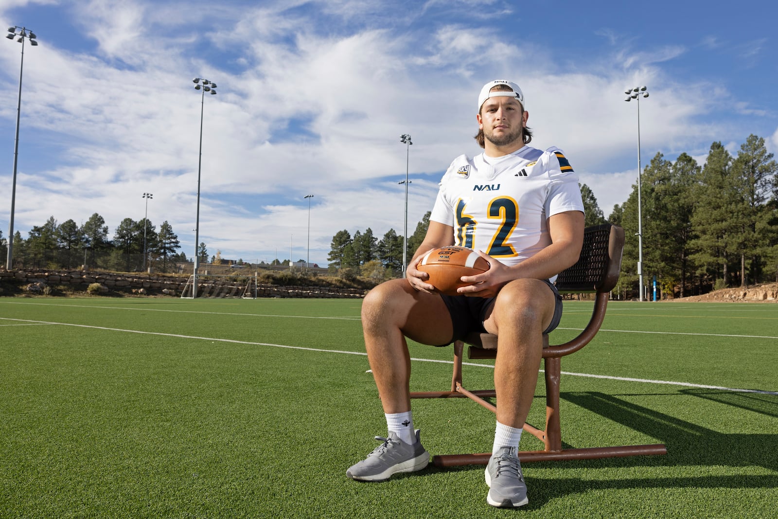 Northern Arizona University's Jonny Bottorff took advantage of new NIL money making opportunities and rebooted his college football career. Bottorff poses for a photo on the campus on NAU on Monday, Oct. 28, 2024, in Flagstaff, Ariz. (AP Photo/Josh Biggs)