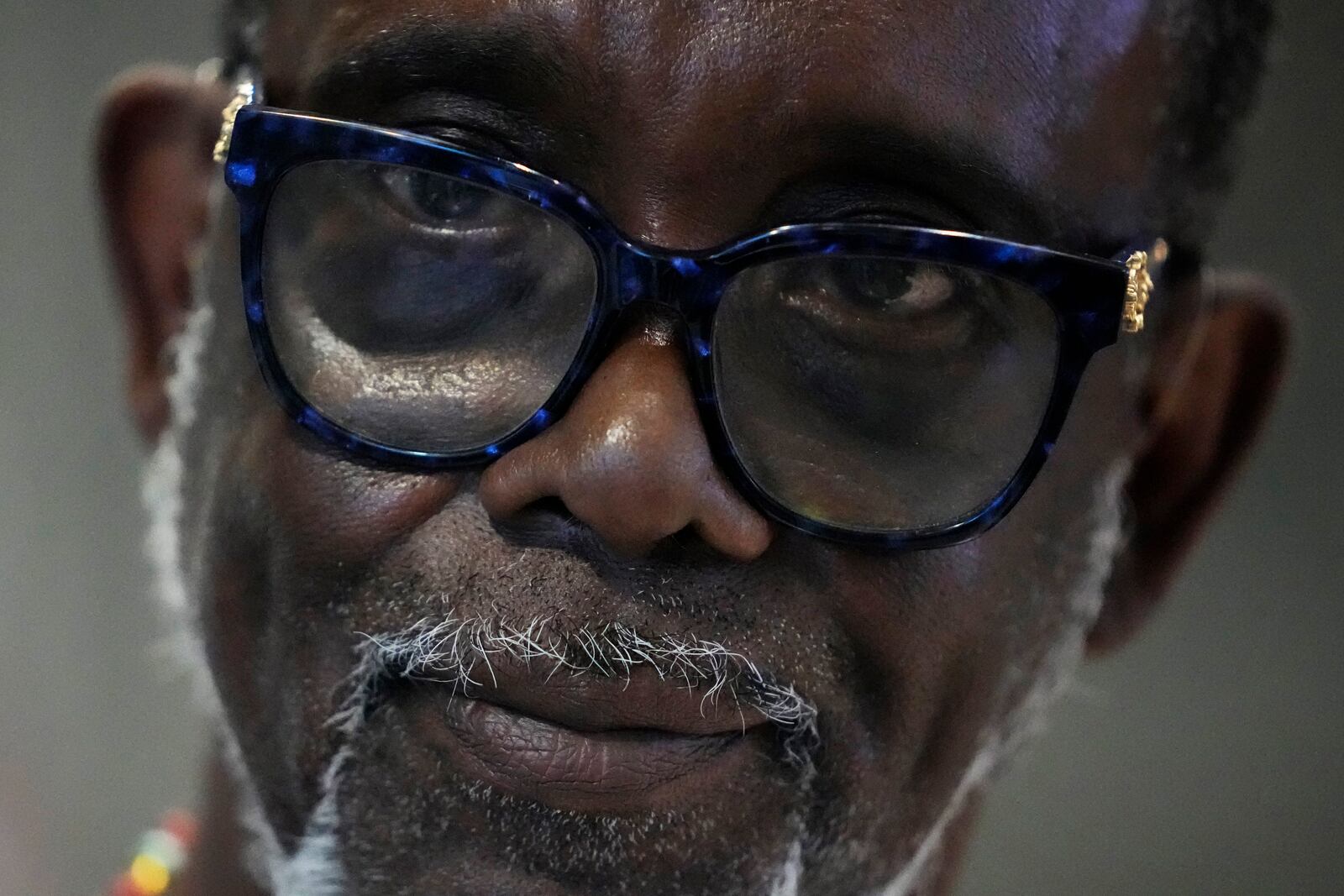 Clyde McLemore, executive director for Black Lives Matter Lake County, listens as he interviews with a reporter after the city council meeting in Waukegan, Ill., Monday, Sept. 16, 2024. (AP Photo/Nam Y. Huh)