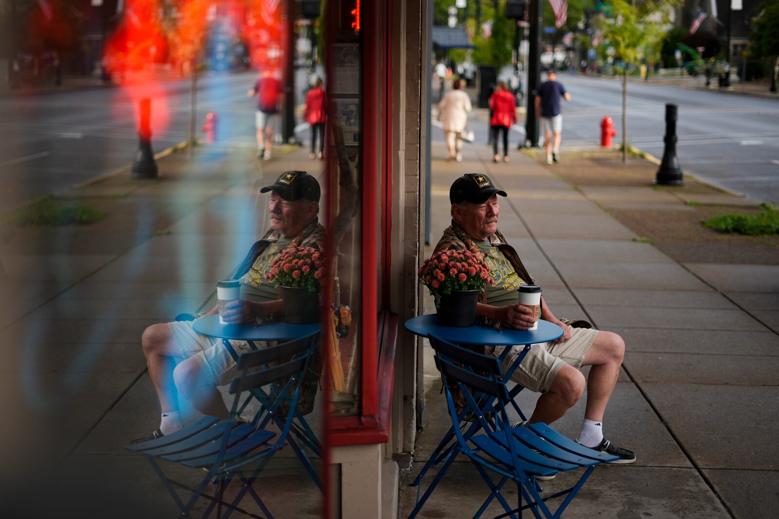 Jim Perry who witnessed an assassination attempt against Republican presidential nominee former President Donald Trump, plans to attend an upcoming rally, sits outside Cummings Candy & Coffee in Butler, Saturday, Sept. 28, 2024. (AP Photo/Matt Rourke)