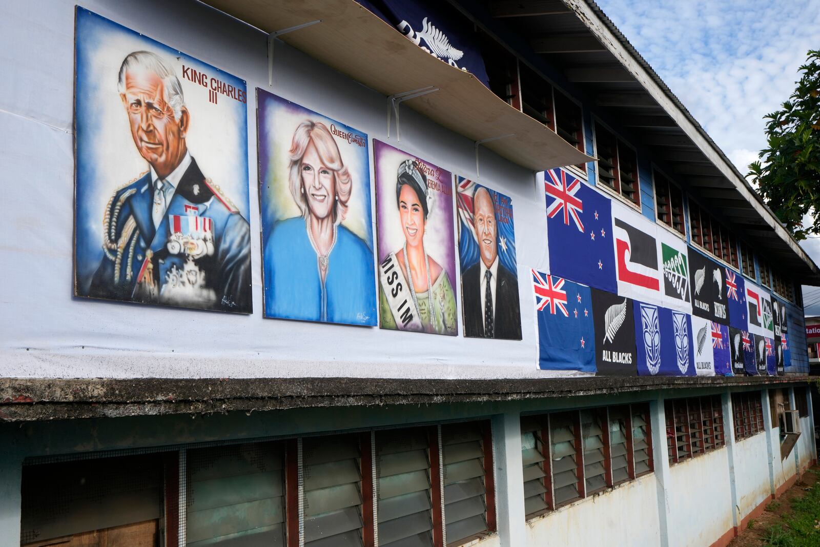 Painted portraits of King Charles III and Queen Camilla are displayed at a school in Apia, Samoa, on Sunday, Oct. 20, 2024, before a visit of the royals ahead of the Commonwealth Heads of Government meetings starting later in the week. (AP Photo/Rick Rycroft)