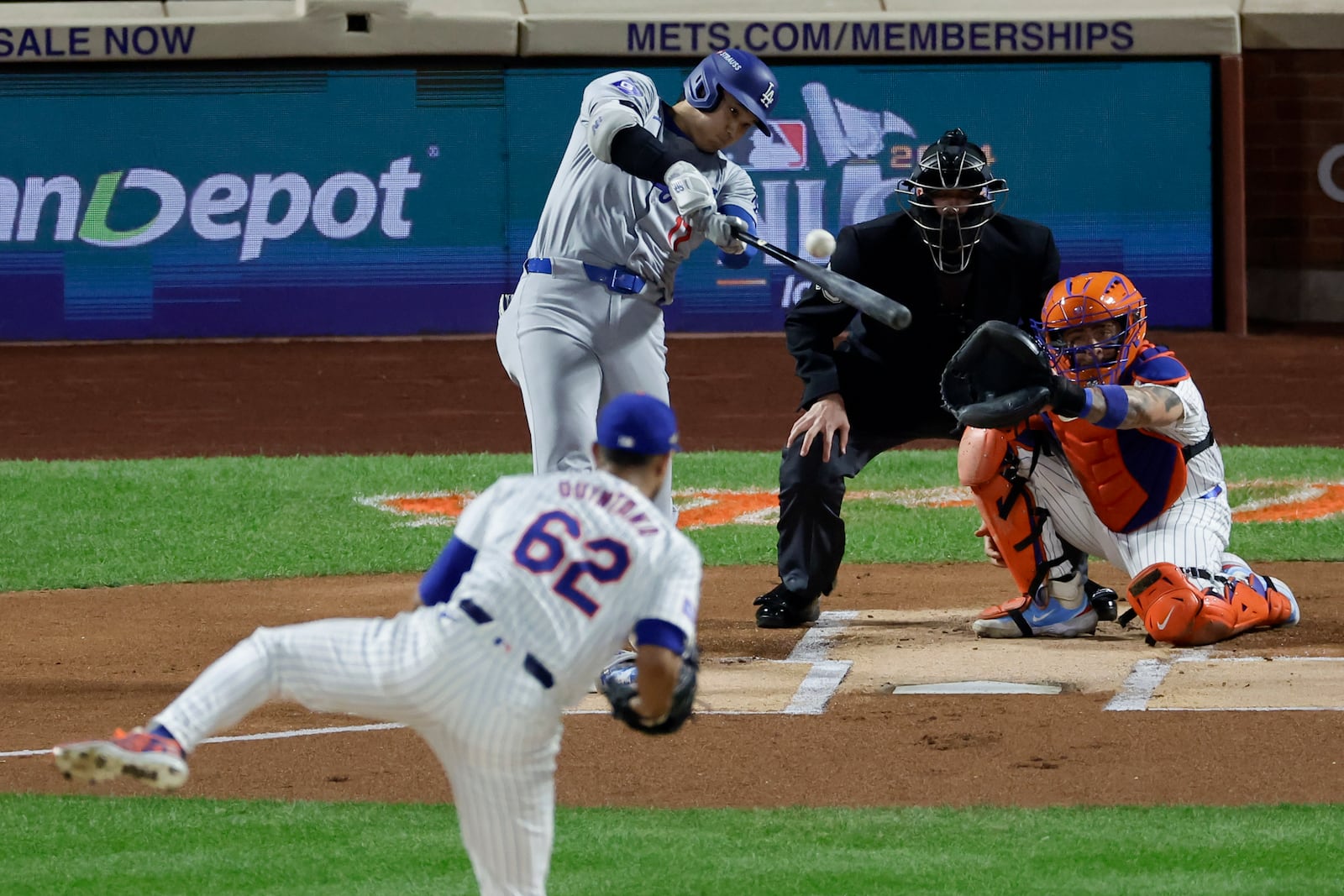 Los Angeles Dodgers' Shohei Ohtani hits a home run against the New York Mets during the first inning in Game 4 of a baseball NL Championship Series, Thursday, Oct. 17, 2024, in New York. (AP Photo/Adam Hunger)