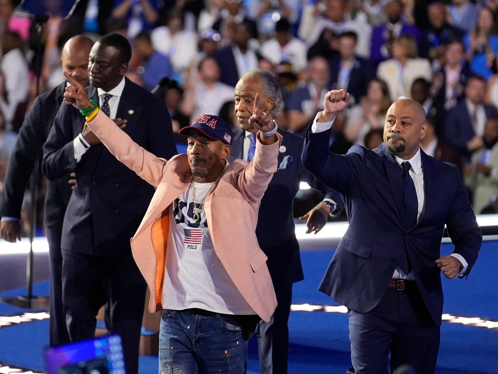 FILE - The Central Park Five join Reverend Al Sharpton during the Democratic National Convention, Aug. 22, 2024, in Chicago. (AP Photo/Charles Rex Arbogast, file)