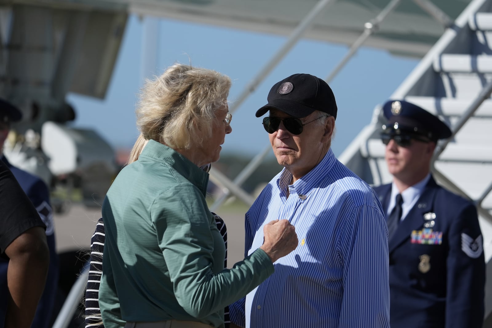 Tampa, Fla. Mayor Jane Castor, left, speaks with President Joe Biden as he arrives at MacDill Air Force Base, Sunday, Oct. 13, 2024, in Tampa, Fla. (AP Photo/Manuel Balce Ceneta)