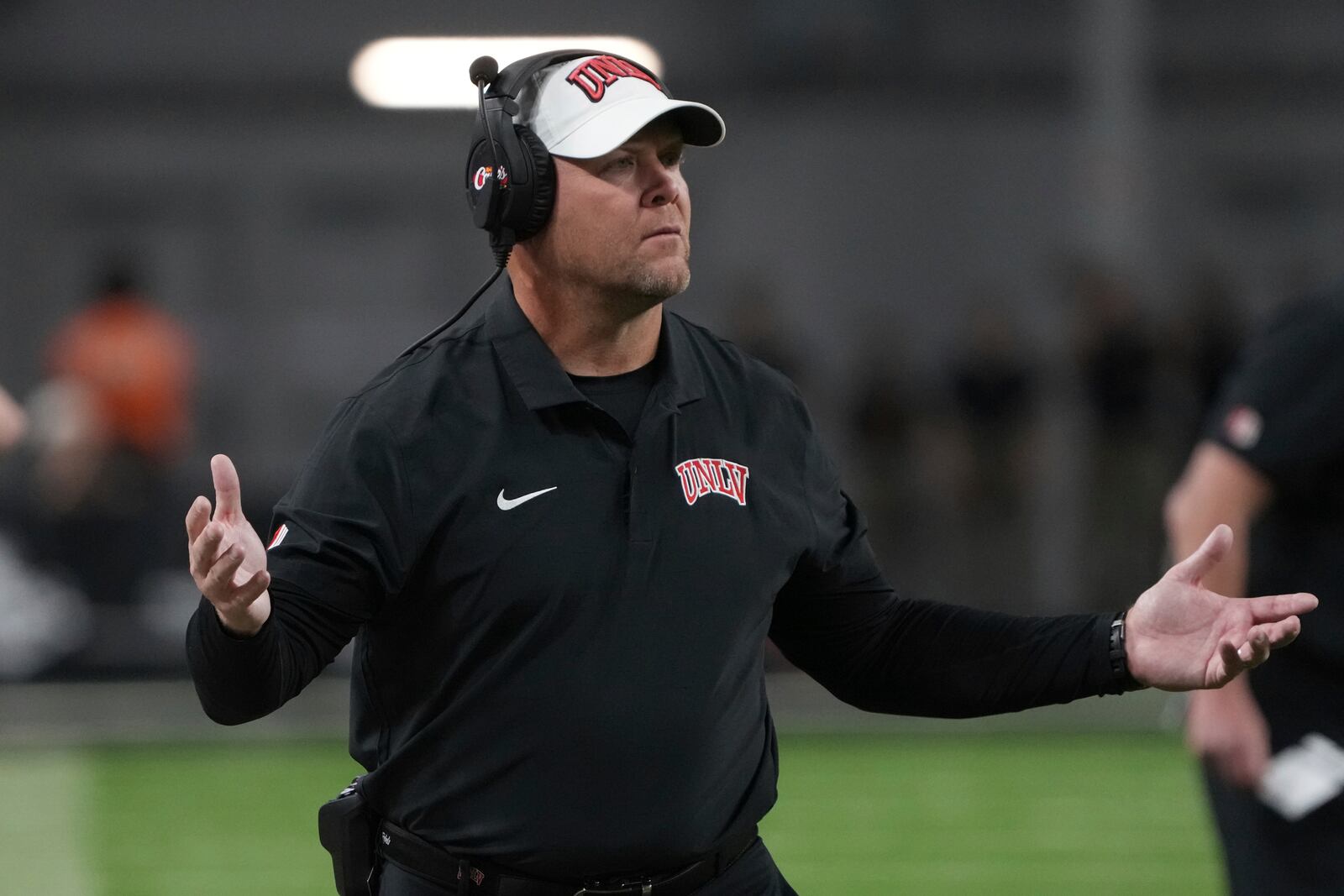 UNLV head coach Barry Odom reacts to a holding foul in the first half during an NCAA college football game against Syracuse, Friday, Oct. 4, 2024, in Las Vegas. (AP Photo/Rick Scuteri)