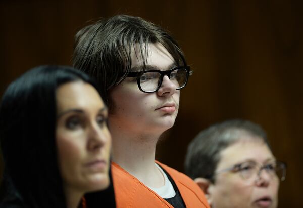 FILE - Ethan Crumbley stands with his attorneys, Paulette Loftin and Amy Hopp, during his hearing at Oakland County Circuit Court, Aug. 1, 2023, in Pontiac, Mich. (Clarence Tabb Jr./Detroit News via AP, Pool)