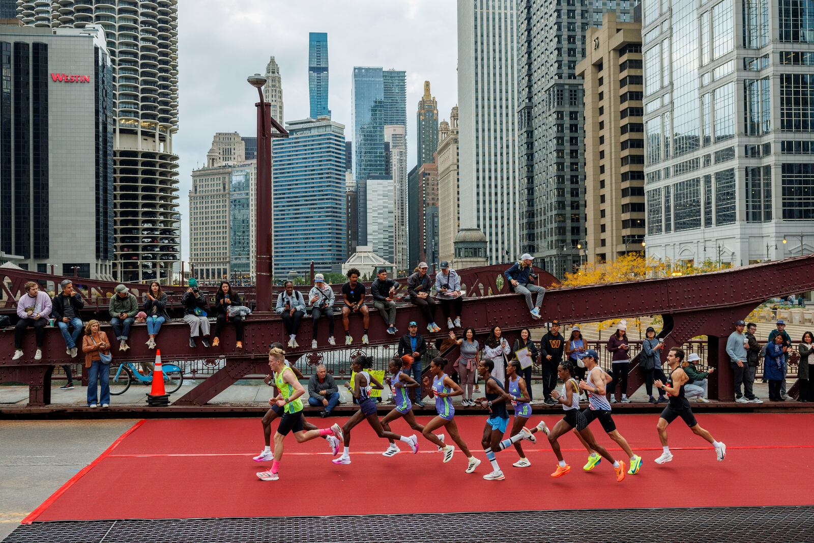 Runners cross the LaSalle Street bridge during the Chicago Marathon Sunday Oct. 13, 2024, in Chicago. (Armando L. Sanchez//Chicago Tribune via AP)