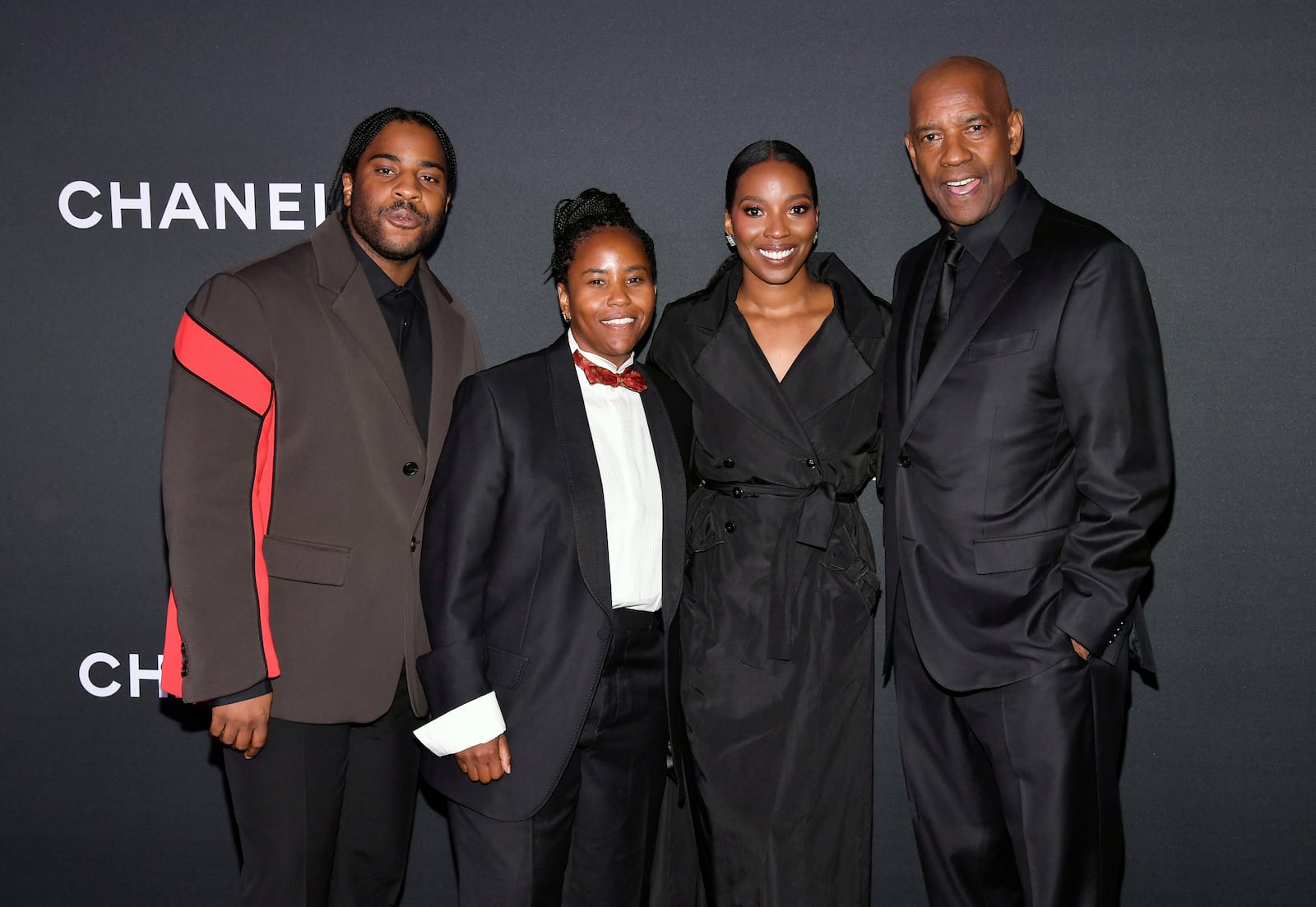 Denzel Washington, far right, poses with his children Malcolm Washington, left, Katia Washington and Olivia Washington at the 16th annual Museum of Modern Art Film Benefit, presented by Chanel, honoring Samuel L. Jackson on Wednesday, Oct. 23, 2024, in New York. (Photo by Evan Agostini/Invision/AP)