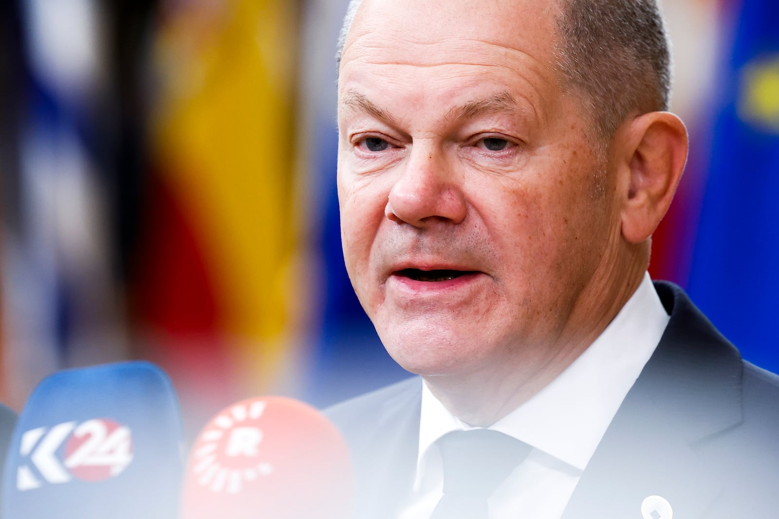 Germany's Chancellor Olaf Scholz talks to journalists as he arrives to an EU summit in Brussels, Thursday, Oct. 17, 2024. (AP Photo/Geert Vanden Wijngaert)