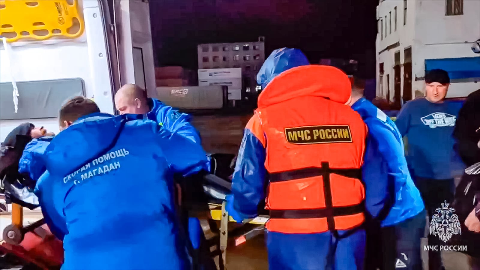 In this photo taken from video released by Russian Emergency Ministry Press Service on Tuesday, Oct. 15, 2024, Russian emergency workers transfer Mikhail Pichugin into an ambulance ashore after he was rescued by a fishing vessel following 67 days adrift in the Sea of Okhotsk near the village of Ust-Khairuzovo in Kamchatka region of Russian far east. (Russian Emergency Ministry Press Service via AP)