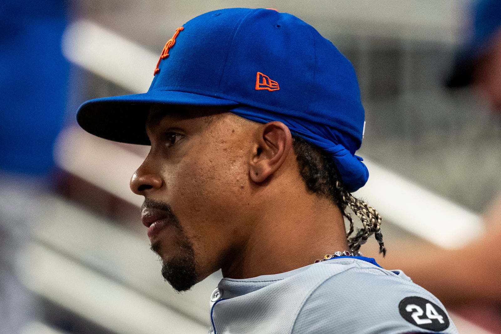 New York Mets shortstop Francisco Lindor sits in the dugout during the third inning of a baseball game against the Atlanta Braves, Tuesday, Sept. 24, 2024, in Atlanta. (AP Photo/Jason Allen)