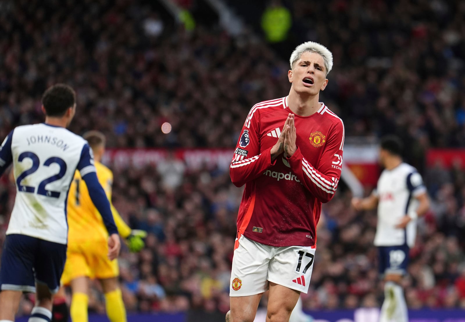 Manchester United's Alejandro Garnacho reacts during the English Premier League soccer match between Manchester United and Tottenham Hotspur at Old Trafford stadium in Manchester, England, Sunday, Sept. 29, 2024. (Martin Rickett/PA via AP)