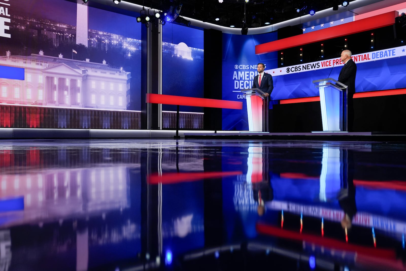 Republican vice presidential nominee Sen. JD Vance, R-Ohio, and Democratic vice presidential candidate Minnesota Gov. Tim Walz participate in a vice presidential debate hosted by CBS News Tuesday, Oct. 1, 2024, in New York. (AP Photo/Matt Rourke)