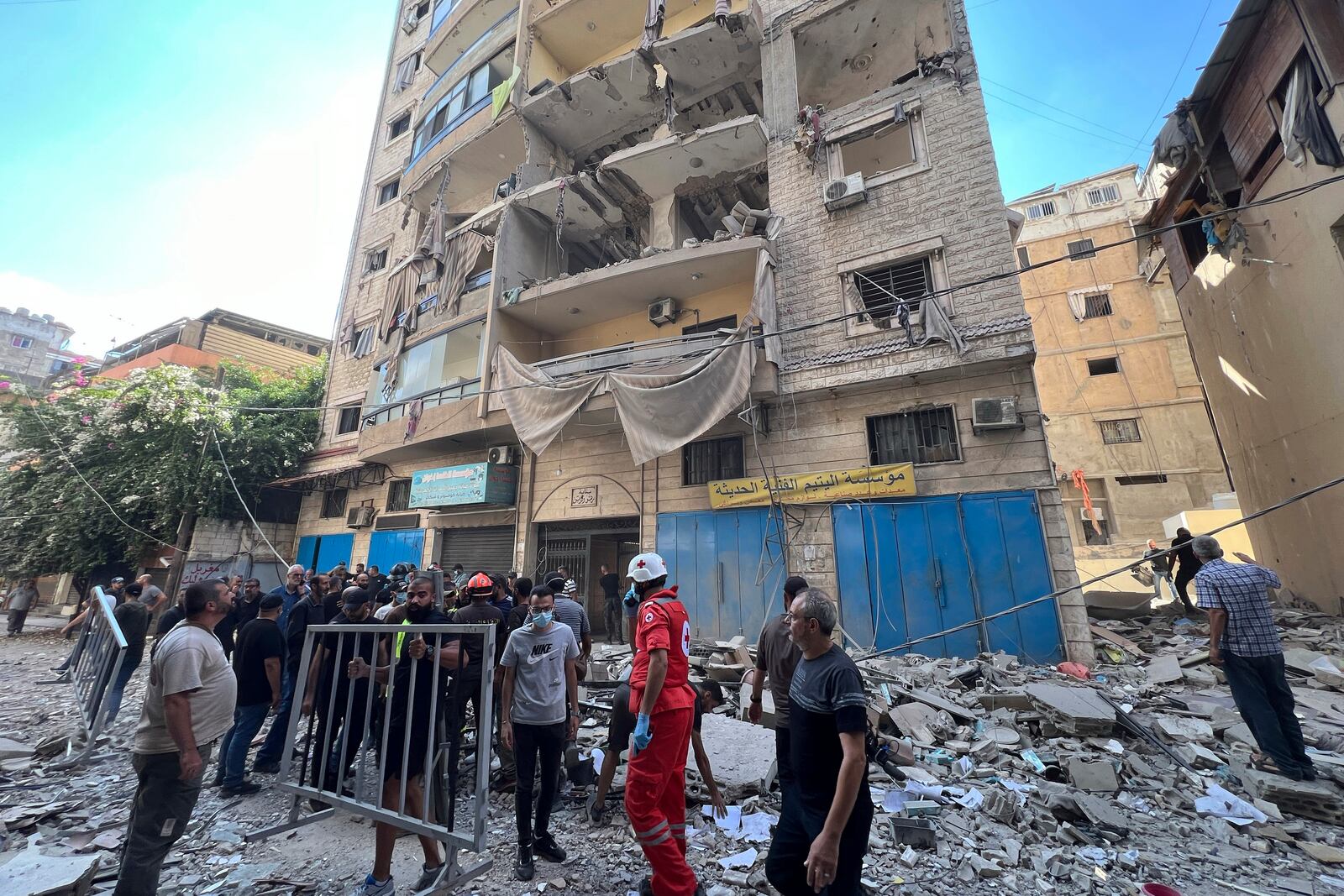 Rescuers arrive at the scene of an Israeli airstrike in Beirut's suburb of Ghobeiri, Sunday, Sept. 29, 2024. (AP Photo/Hussein Malla)