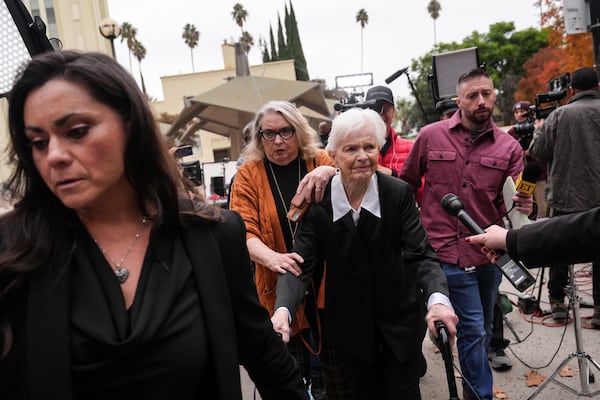 Erik and Lyle Menendez's aunt Joan VanderMolen, center, arrives at a courthouse to attend a hearing in Los Angeles, Monday, Nov. 25, 2024. (AP Photo/Jae C. Hong)