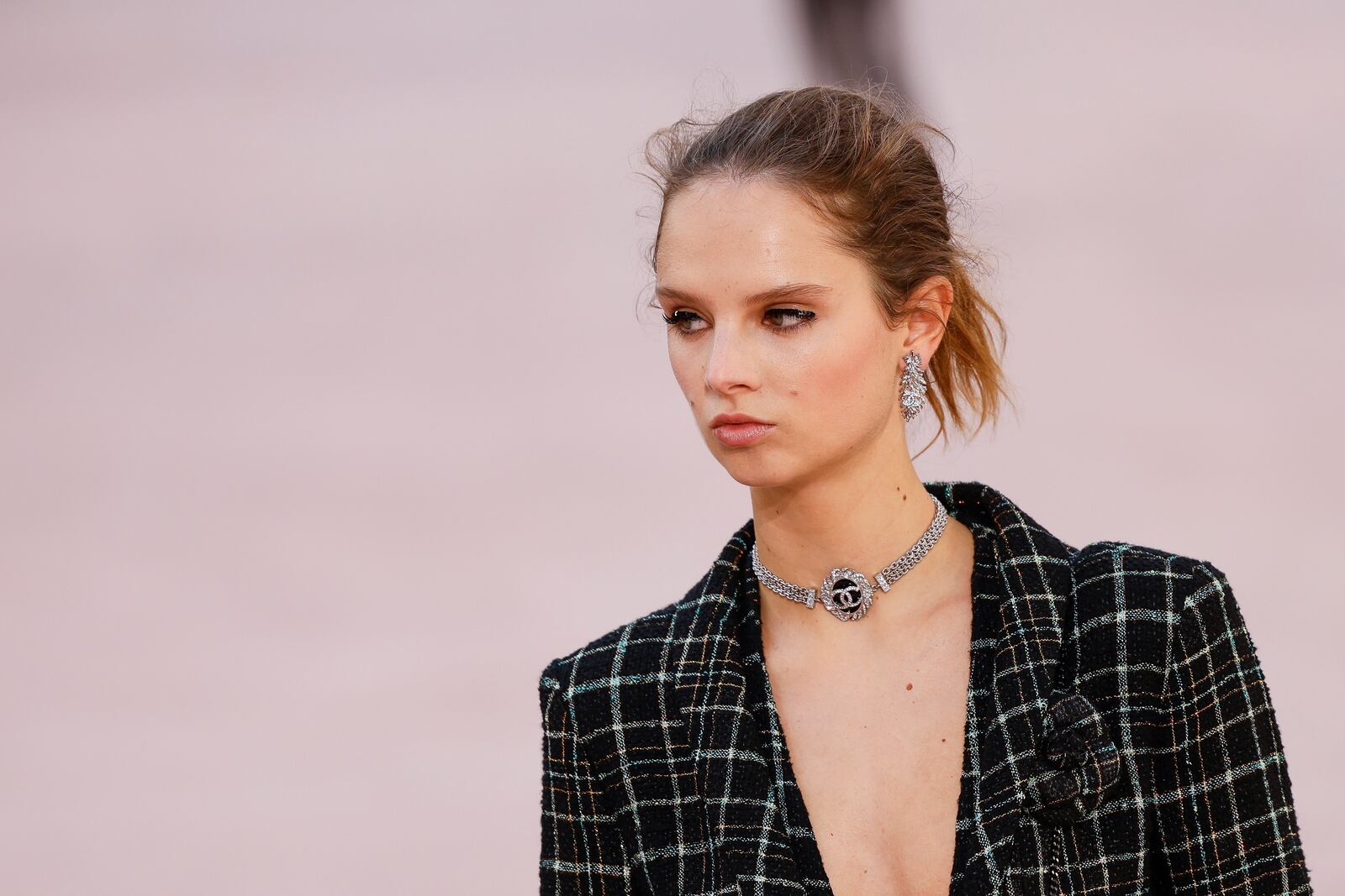 A model wears a creation as part of the Chanel Spring/Summer 2025 collection presented Tuesday, Oct. 1, 2024, in Paris. (Photo by Vianney Le Caer/Invision/AP)