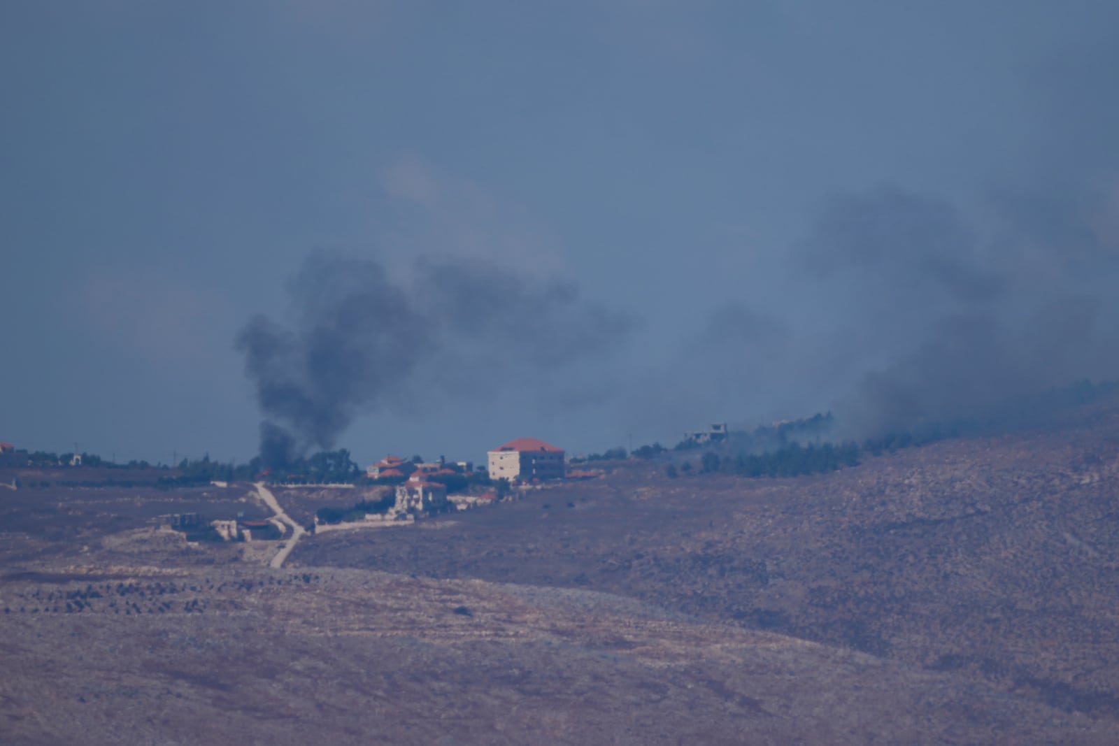 Smoke rises following an Israeli airstrike in southern Lebanon as seen from northern Israel on Sunday, Sept. 29, 2024. (AP Photo/Ariel Schalit)