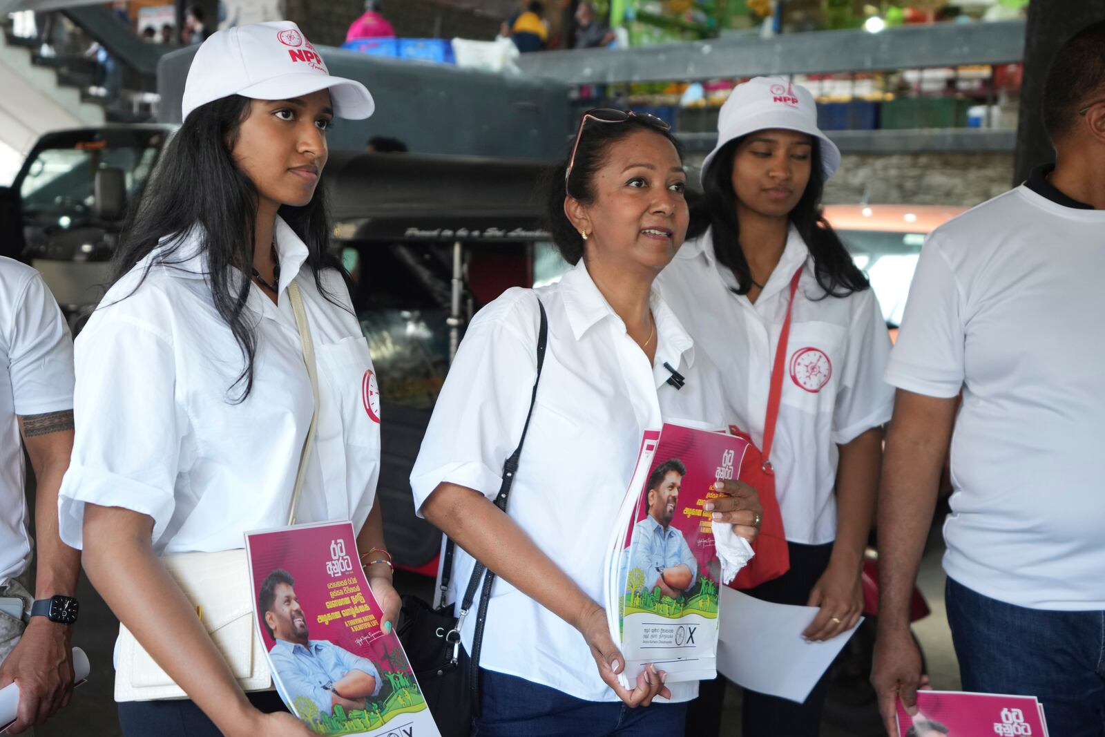 Sri Lankan women, who live outside of Sri Lanka, campaign for the National People's Power presidential candidate Anura Dissanayaka, in Colombo, Sri Lanka, Wednesday, Sept. 18, 2024. (AP Photo/Rajesh Kumar Singh)