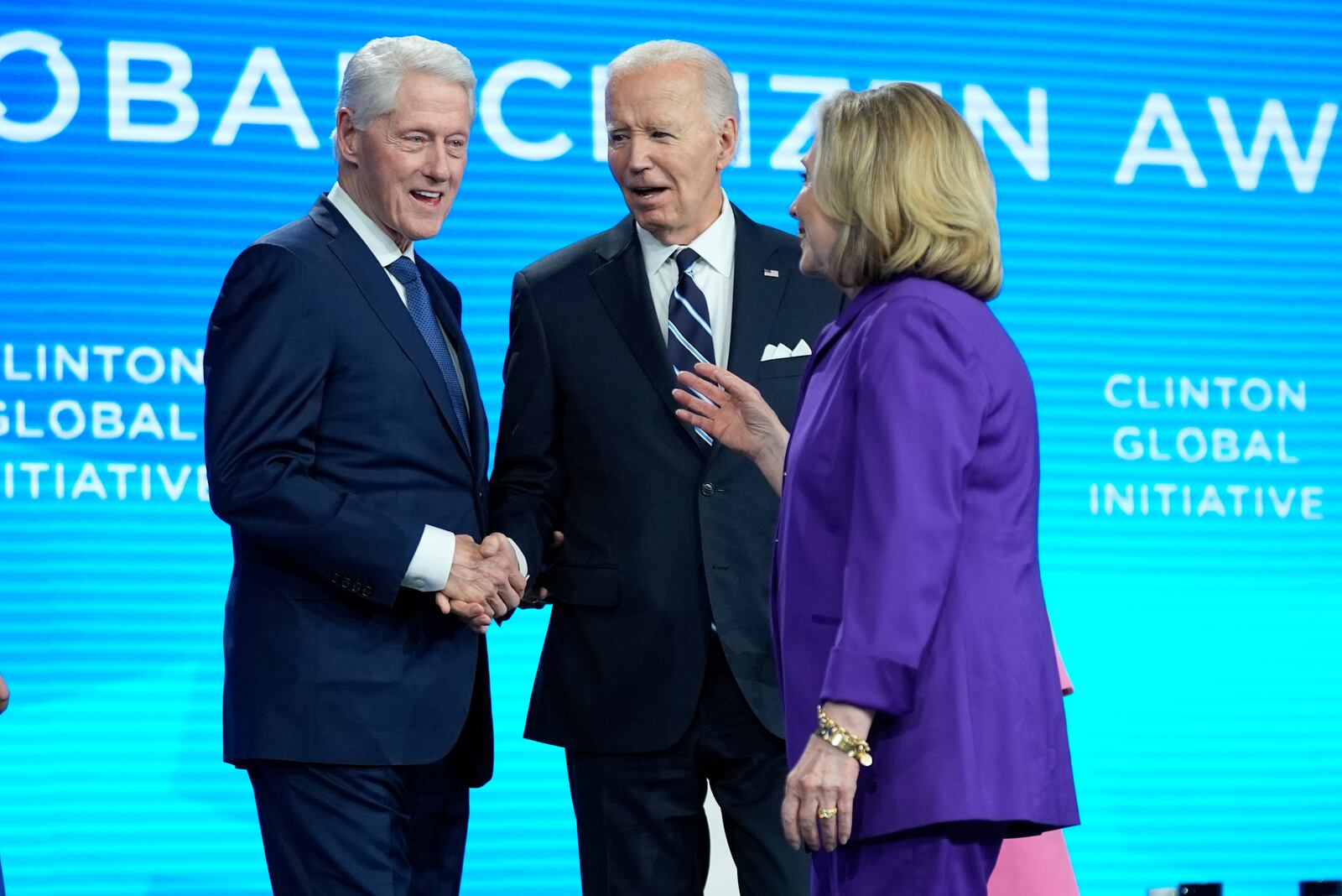 President Joe Biden talks with former Secretary of State Hillary Clinton and former President Bill Clinton as he is presented with the Global Citizen Award at the Clinton Global Initiative Monday, Sept. 23, 2024, in New York. (AP Photo/Manuel Balce Ceneta)