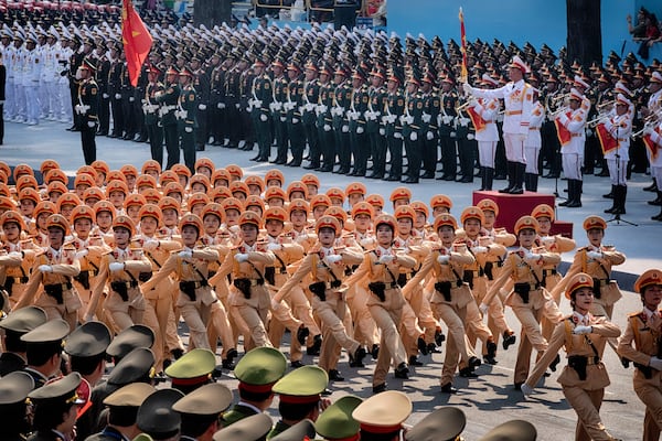 Vietnamese female police officers march during a parade celebrating the 50th anniversary of the end of the Vietnam War on Wednesday, April 30, 2025, in Ho Chi Minh City, Vietnam. (AP Photo/Richard Vogel)