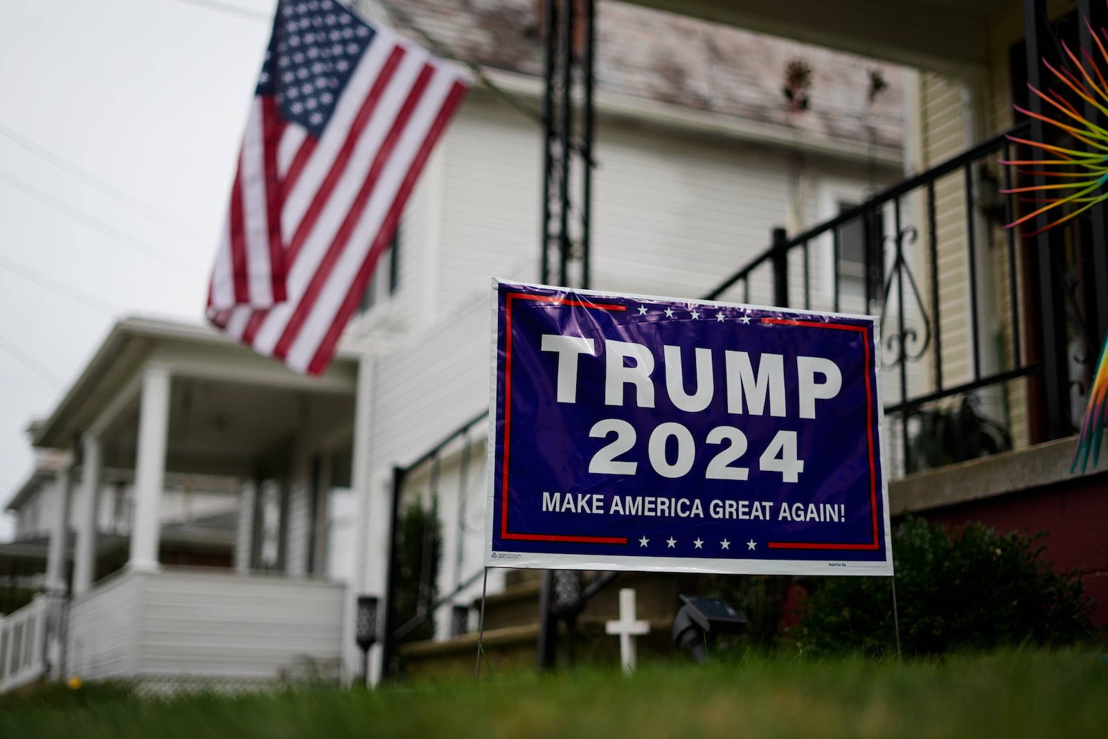 A sign supporting Republican presidential nominee former President Donald Trump is posted in Jim Hulings, chairman of the Butler County Republican Committee yard in Zelienople, Thursday, Sept. 26, 2024. (AP Photo/Matt Rourke)