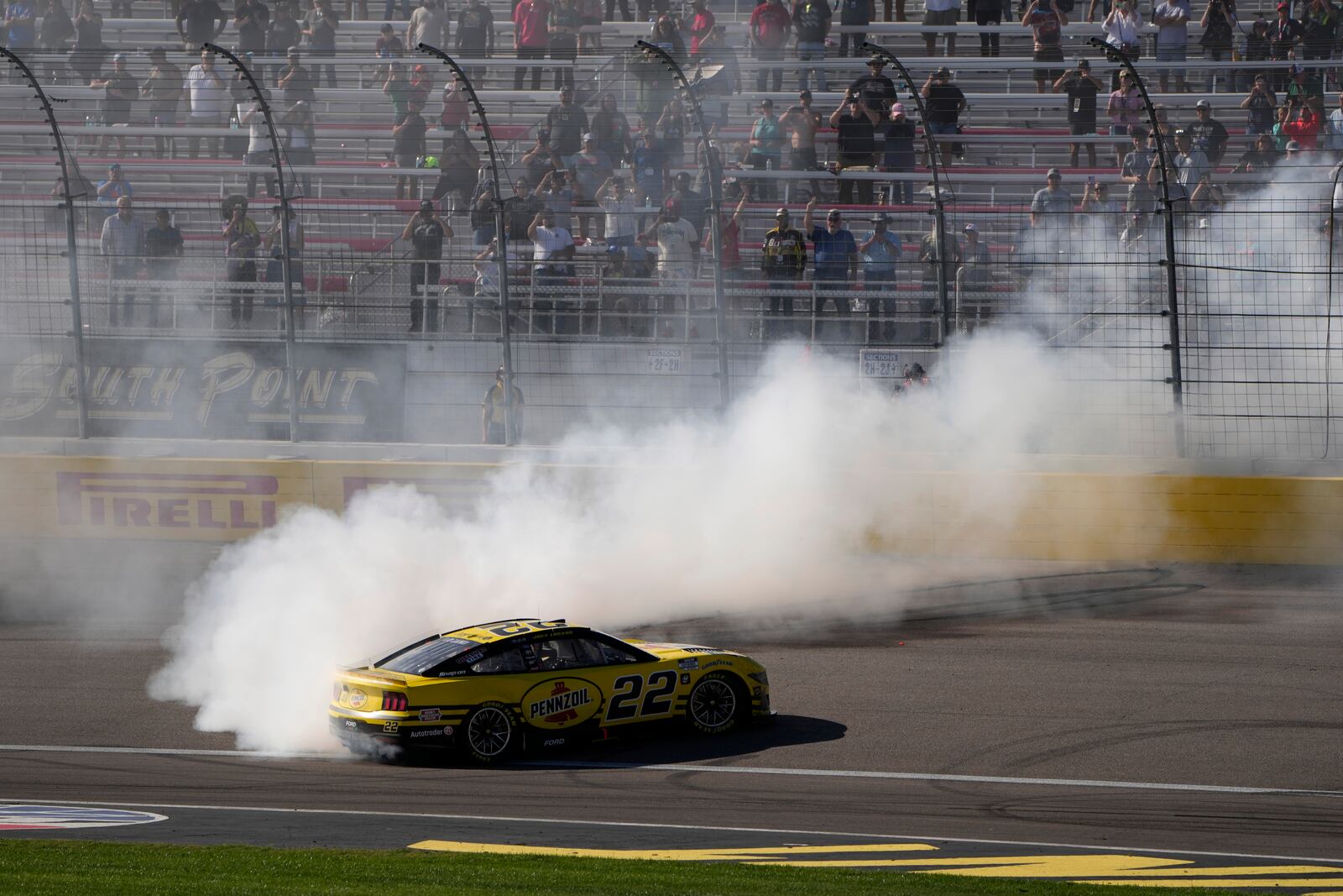 NASCAR Cup Series driver Joey Logano (22) does a burnout after winning a NASCAR Cup Series auto race Sunday, Oct. 20, 2024, in Las Vegas. (AP Photo/John Locher)