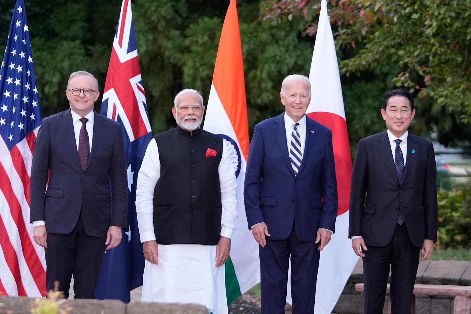 President Joe Biden, joined by Australia's Prime Minister Anthony Albanese, Japan's Prime Minister Fumio Kishida, and India's Prime Minister Narendra Modi, stand for a group photo before speaking about a Quadrilateral Cancer Moonshot initiative on the sidelines of the Quad leaders summit at Archmere Academy in Claymont, Del., Saturday, Sept. 21, 2024. (AP Photo/Mark Schiefelbein)