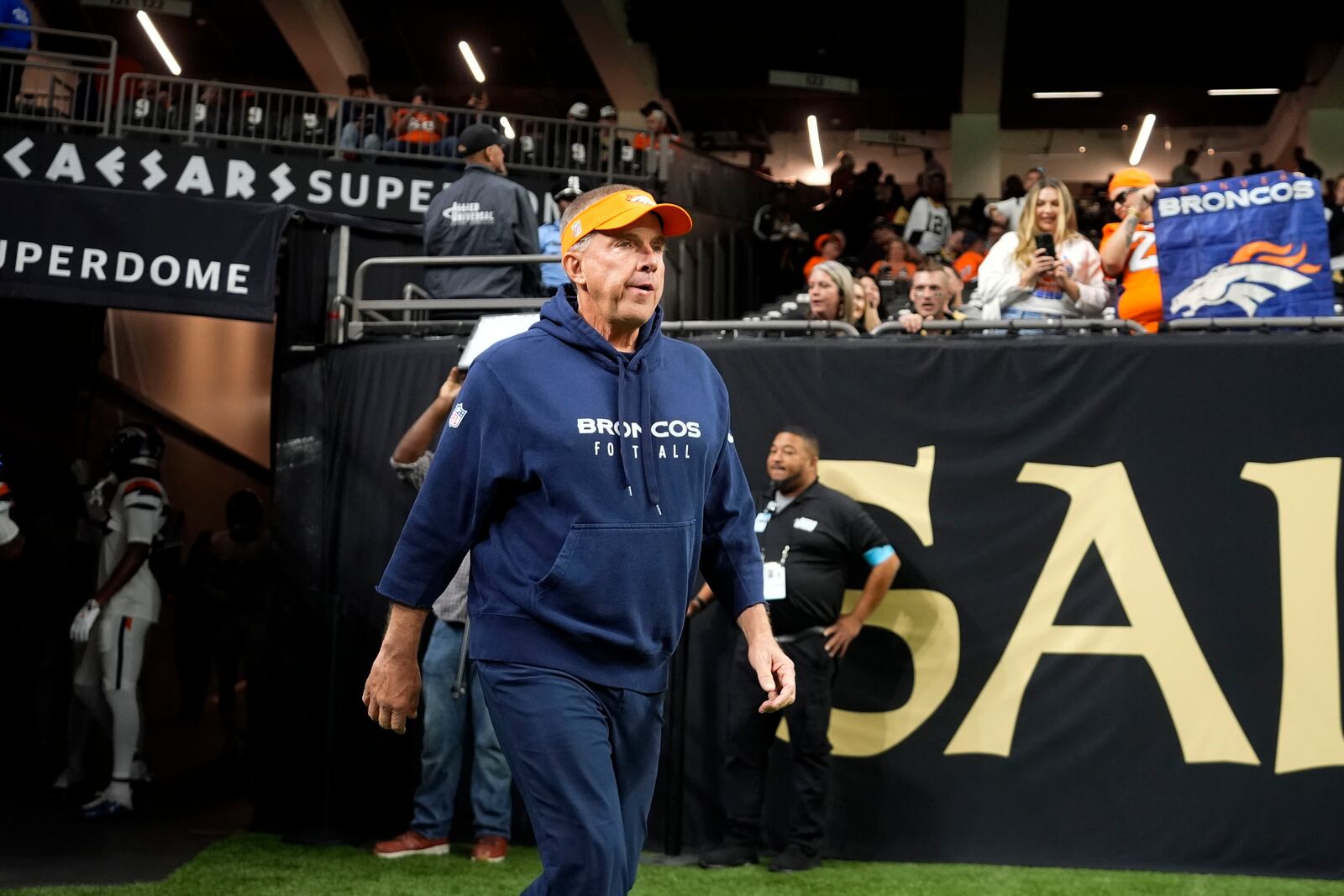 Denver Broncos head coach Sean Payton walks onto the field before an NFL football game against the New Orleans Saints, Thursday, Oct. 17, 2024, in New Orleans. (AP Photo/Gerald Herbert)