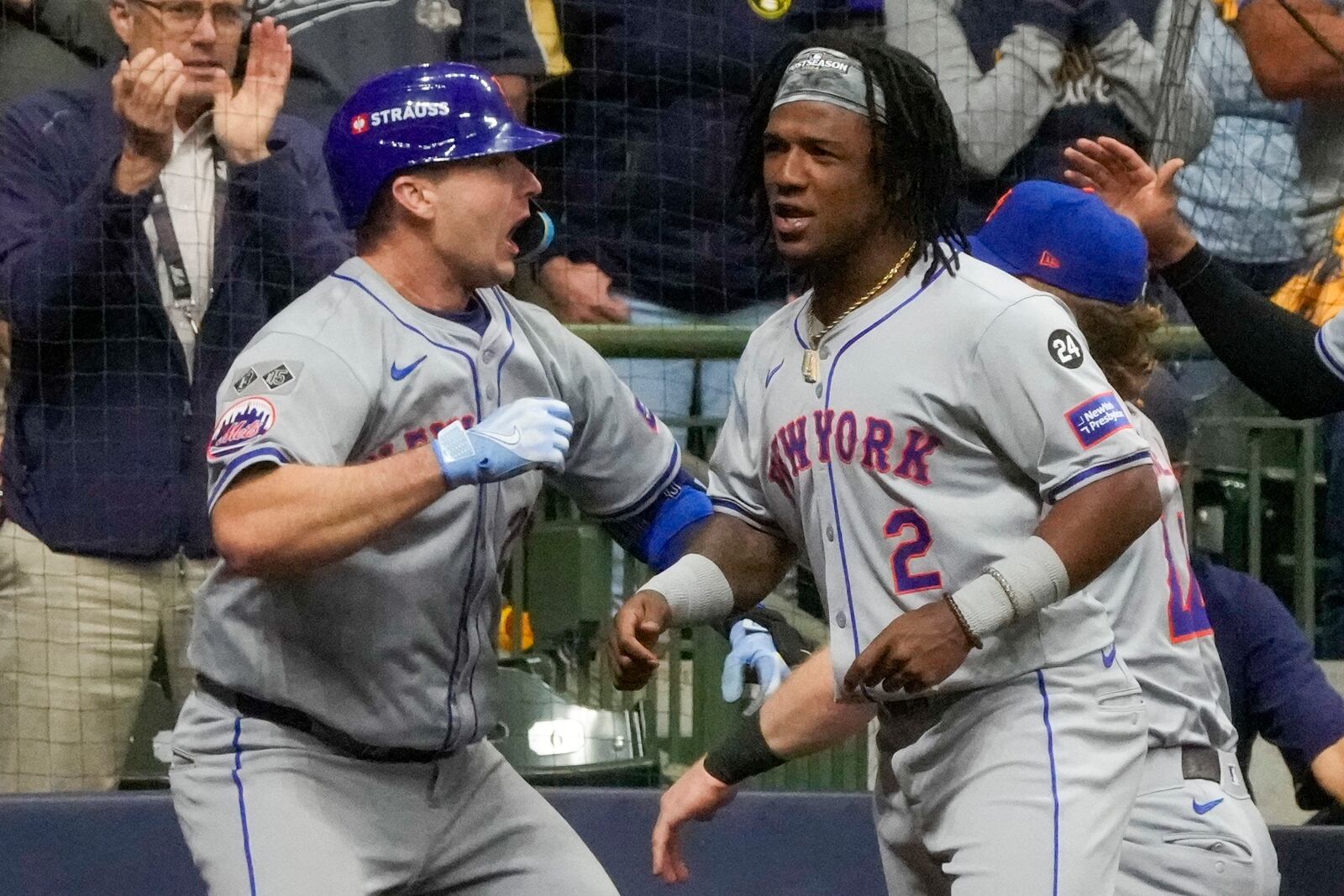 New York Mets' Pete Alonso celebrates his three-run home run with Luisangel Acuña during the ninth inning of Game 3 of a National League wild card baseball game against the Milwaukee Brewers Thursday, Oct. 3, 2024, in Milwaukee. (AP Photo/Morry Gash)