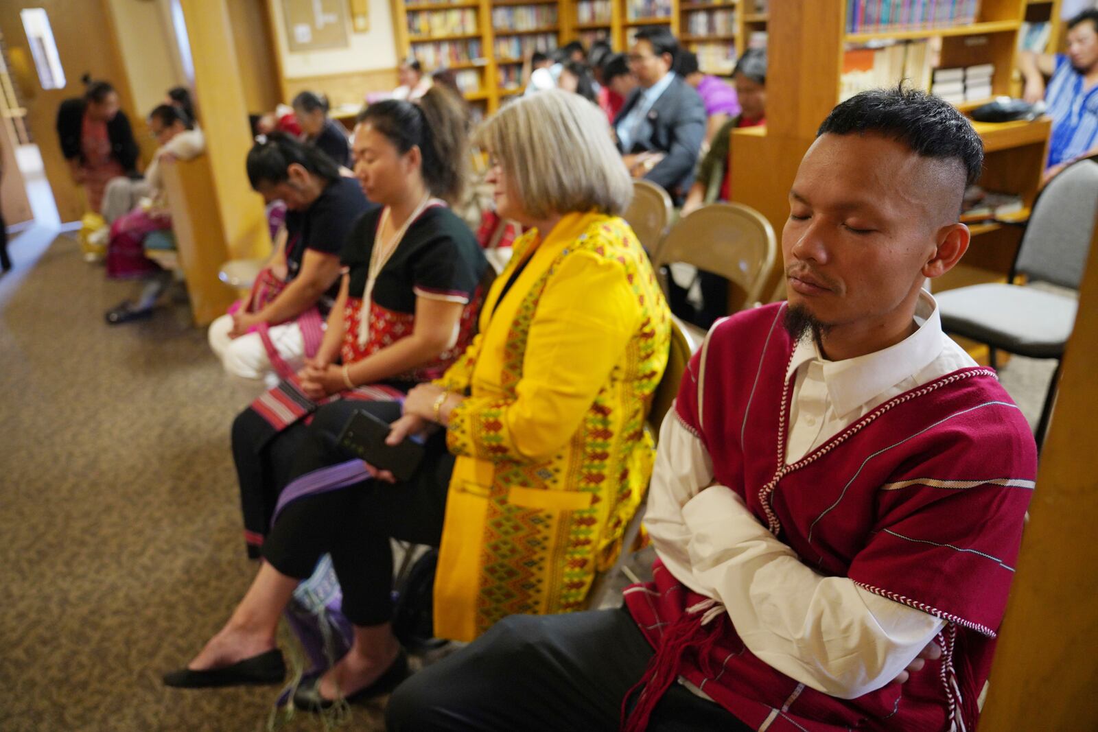 Parishioners pray during a Karen-language service at Indian Lake Baptist Church, while celebrating 15 years of partnership with the 150-year-old congregation founded by Swedish immigrants, in Worthington, Minn., on Sunday Oct. 20, 2024. (AP Photo/Jessie Wardarski)