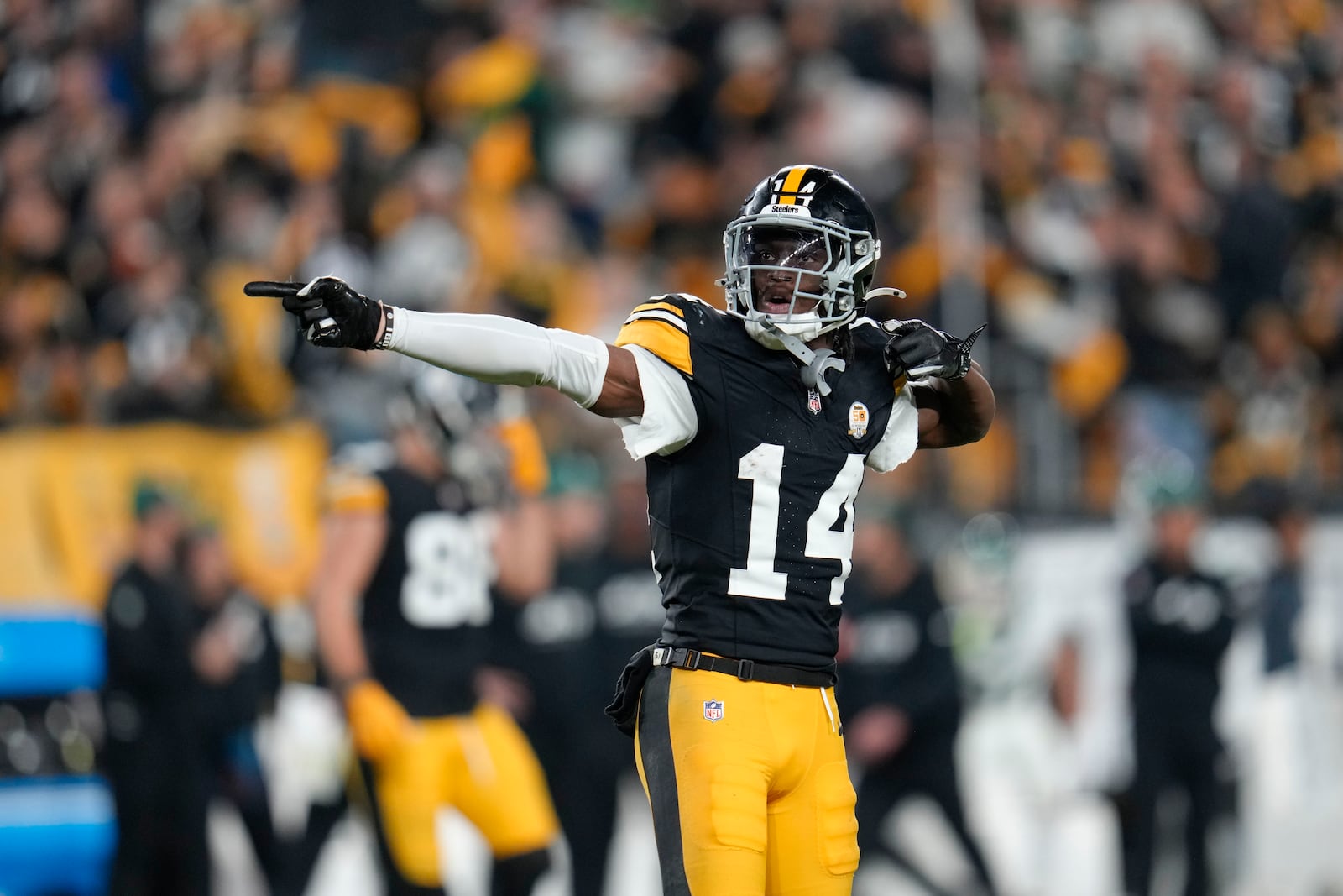 Pittsburgh Steelers wide receiver George Pickens (14) celebrates a first down catch in the second half of an NFL football game against the New York Jets in Pittsburgh, Sunday, Oct. 20, 2024. (AP Photo/Gene J. Puskar)