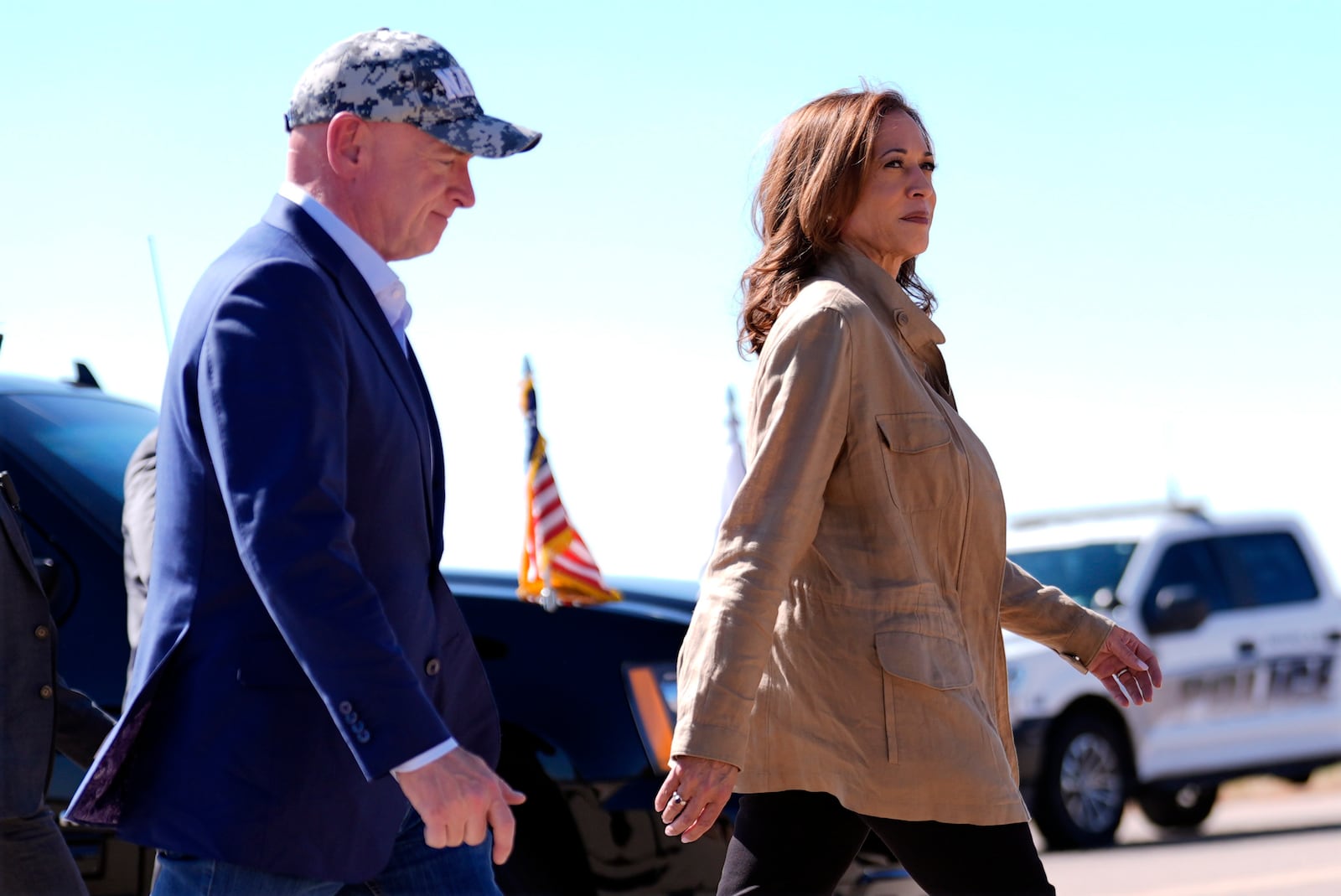 Democratic presidential nominee Vice President Kamala Harris followed by Sen. Mark Kelly, D-Ariz., walks after arriving in Douglas, Ariz., Friday, Sept. 27, 2024. (AP Photo/Carolyn Kaster)