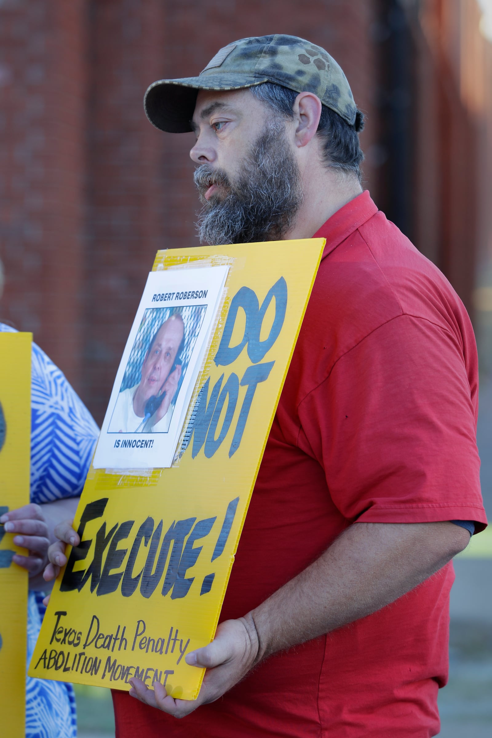 Thomas Roberson, older brother of condemned prisoner Robert Roberson, protests with others outside the prison where Roberson is scheduled for execution at the Huntsville Unit of the Texas State Penitentiary, Thursday, Oct. 17, 2024, in Huntsville, Texas. (AP Photo/Michael Wyke)