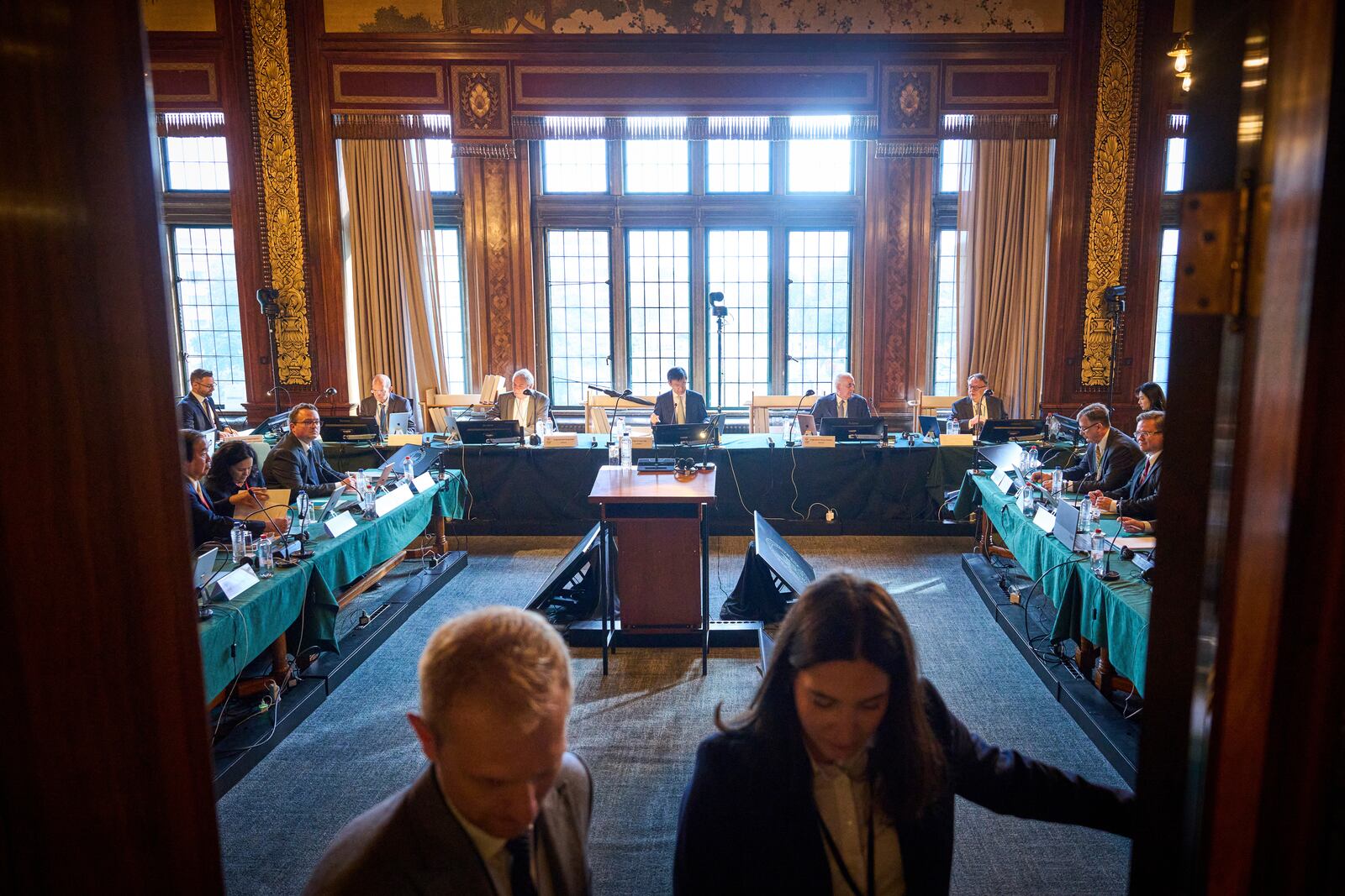 The delegations of Ukraine and Russia attend the start of PCA Case between Ukraine and the Russian Federation in the Netherlands, Monday, Sept. 23, 2024. (AP Photo/Phil Nijhuis)